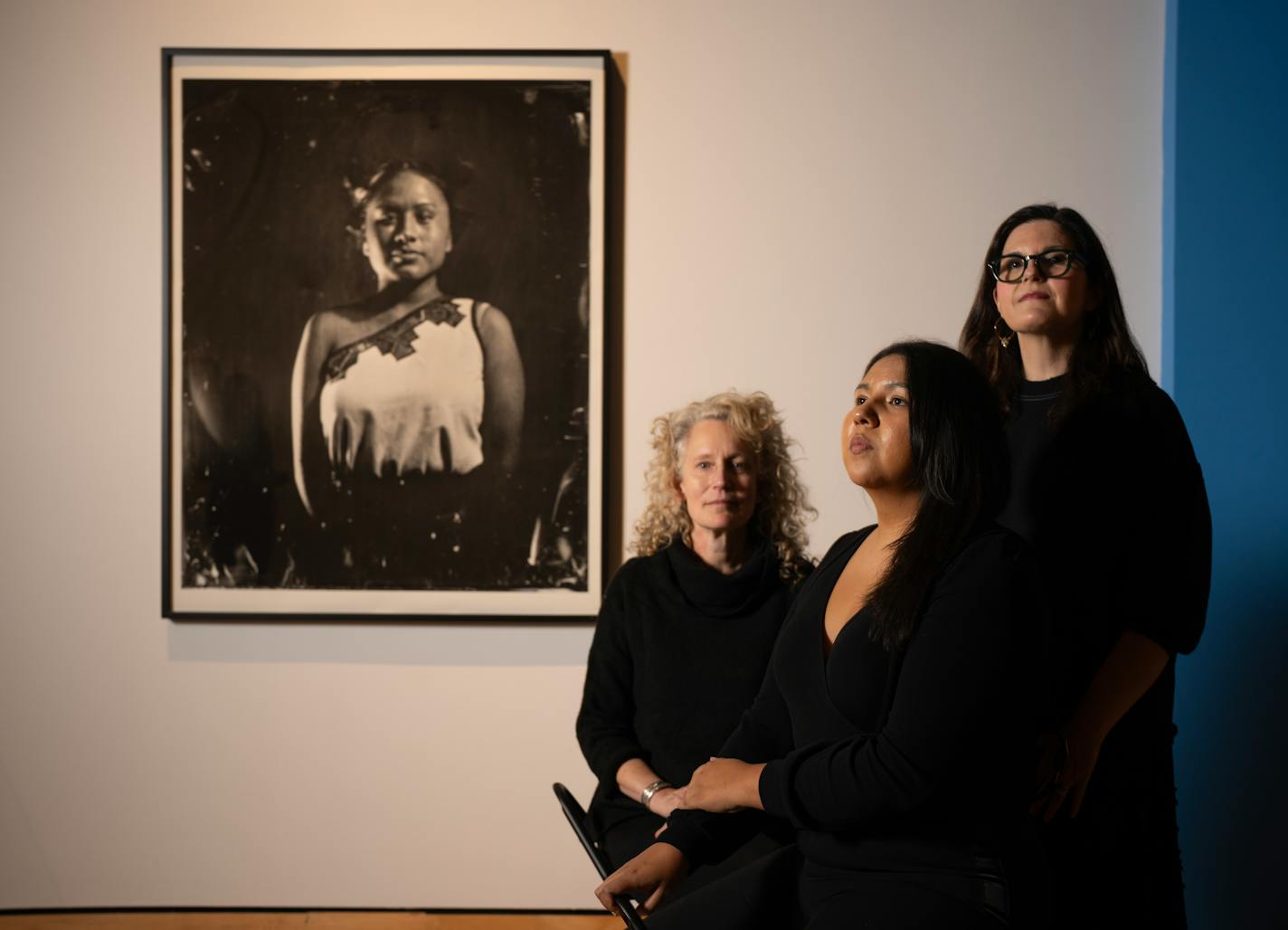 "In Our Hands", a sweeping new exhibition of Indigenous photography opens this weekend at the Minneapolis Institute of Art. It features more than 150 images of, by, and for Native photographers. The curating team was photographed in the gallery where the show is being hung Tuesday afternoon, October 17, 2023. The "In Our Hands" Co-Curators are, from left, Jill Ahlberg Yohe, Jaida Grey Eagle, and Casey Riley. They are with a work in the show by Will Wilson (Diné [Navajo], born 1969)&nbsp;Insurgent Hopi Maiden, Melissa Pochoema, Citizen of the Hopi Tribe, 2015, archival pigment print from wet plate collodion scan. Collection of the artist. Ahlberg Yohe is Associate Curator of Native American Art with MIA. Grey Eagle is a photojournalist, producer, beadwork artist, and writer. Riley is Chair of Global Contemporary Art and Curator of Photography &amp; New Media at MIA. ] JEFF WHEELER • jeff.wheeler@startribune.com