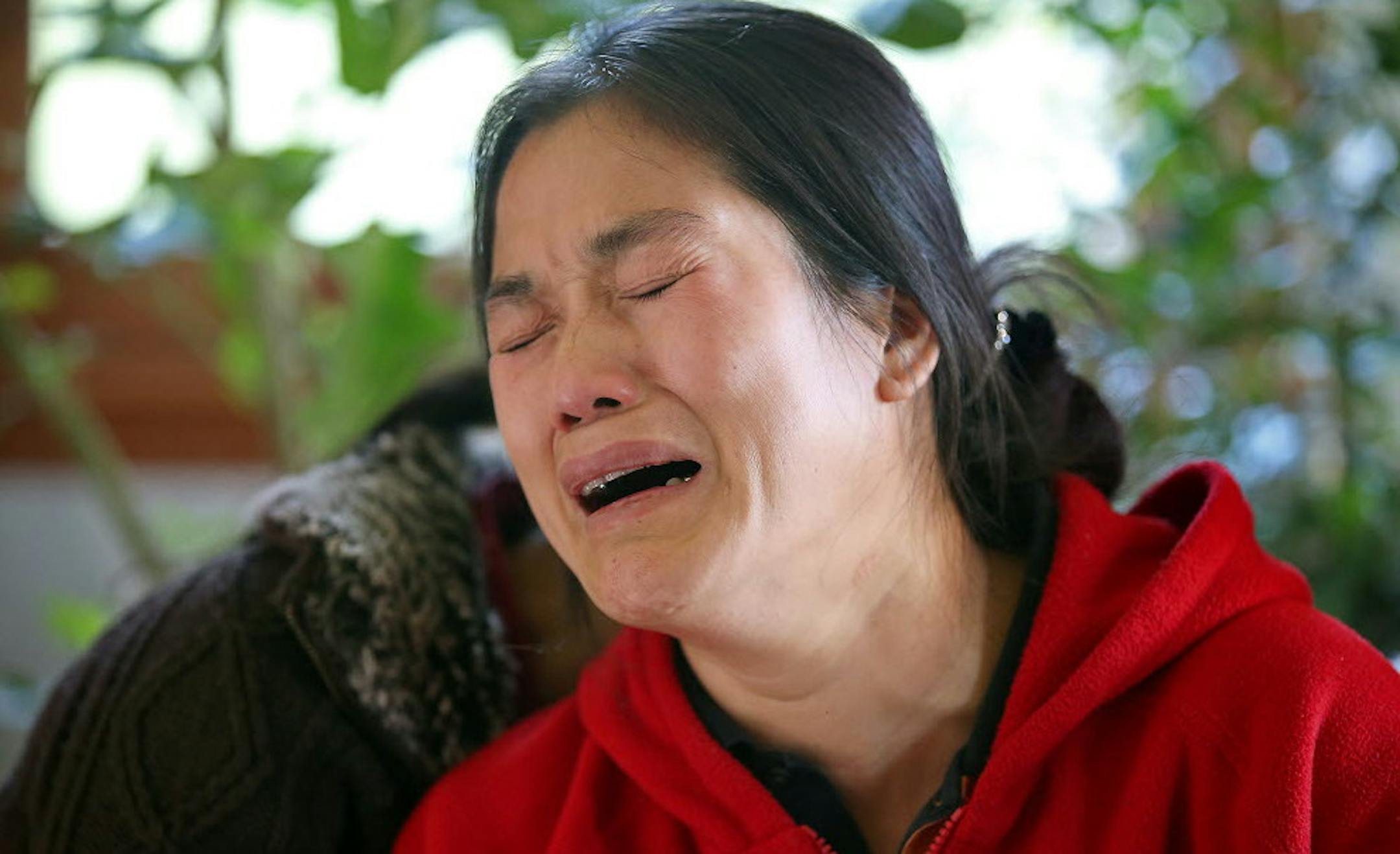 Family killed: An anguished Chanry Soeng spoke of the loss of her husband and two sons after a fire in October at the family's South St. Paul home.