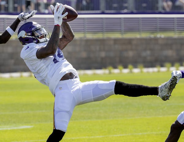Vikings receiver Stefon Diggs caught a pass during practice on Tuesday. Diggs signed a 5-year extension with the team.