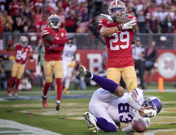 Minnesota Vikings tight end Tyler Conklin (83) can't make the catch for in the end zone as San Francisco 49ers safety Talanoa Hufanga (29) signs no ca