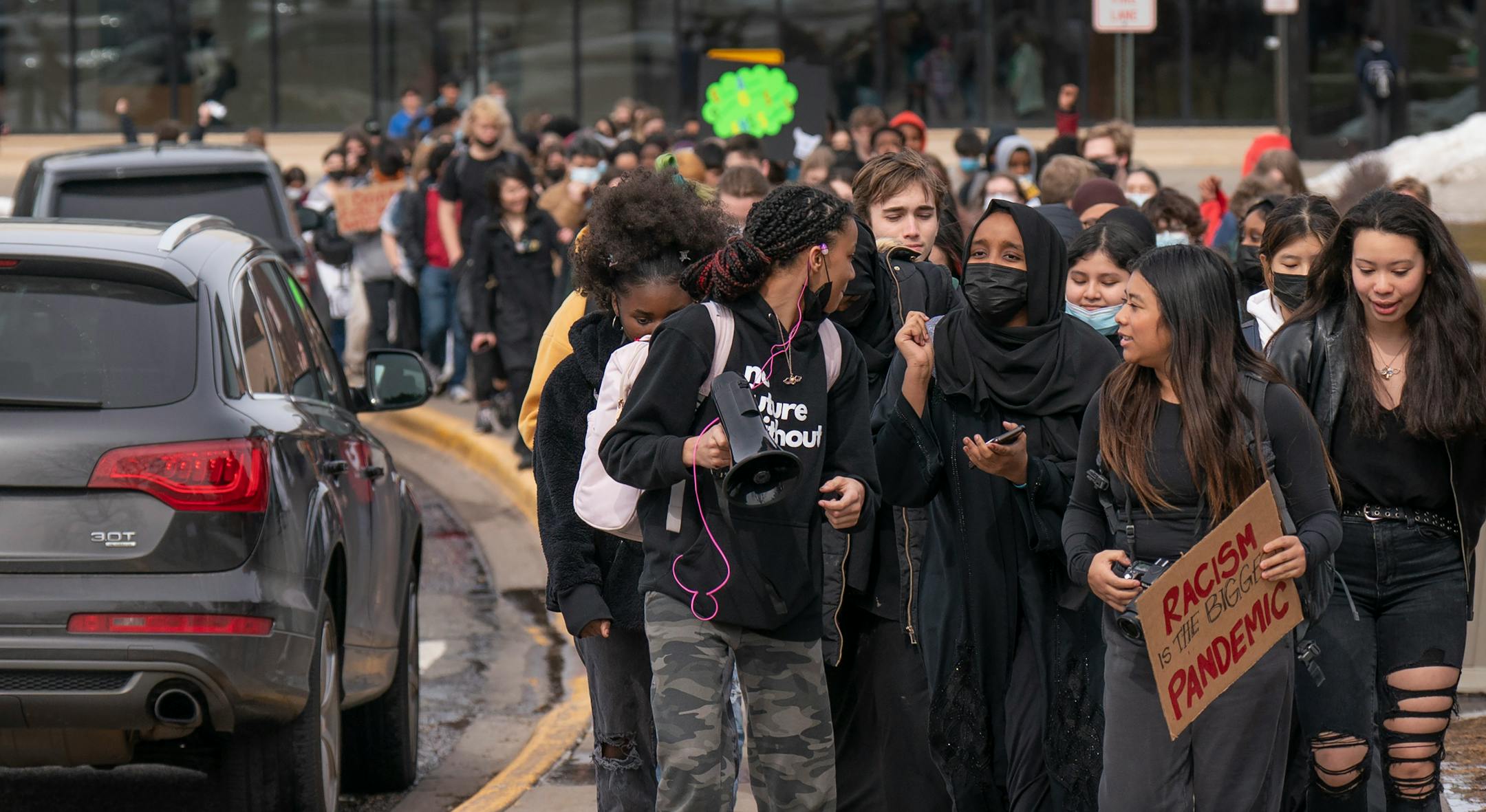 A group of students at Edina High School walked out of school one hour early Thursday. The students gathered to speak about the recent social media video showing students mocking fake Asian accents and giving the Nazi salute in Edina, Minn., on Thursday, March 17, 2022.