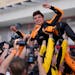 McLaren driver Lando Norris is lifted after winning the Miami Grand Prix for his first career Formula One victory.