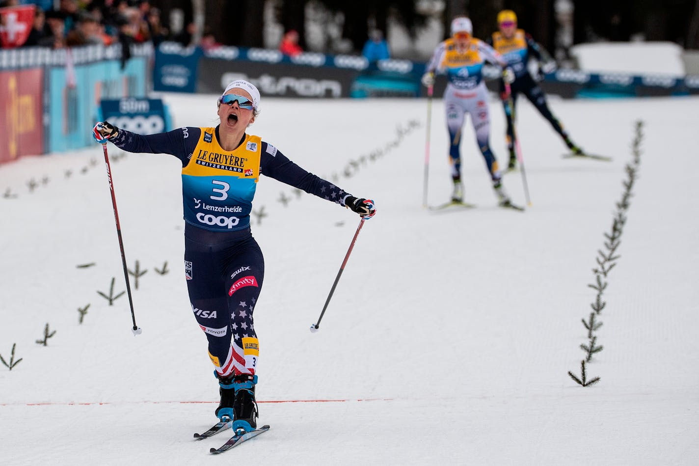 United States' Jessie Diggins celebrates winning a cross-country ski sprint event at the FIS Tour de Ski in Lenzerheide, Switzerland, Tuesday, Dec. 28, 2021. (Peter Schneider/Keystone via AP)