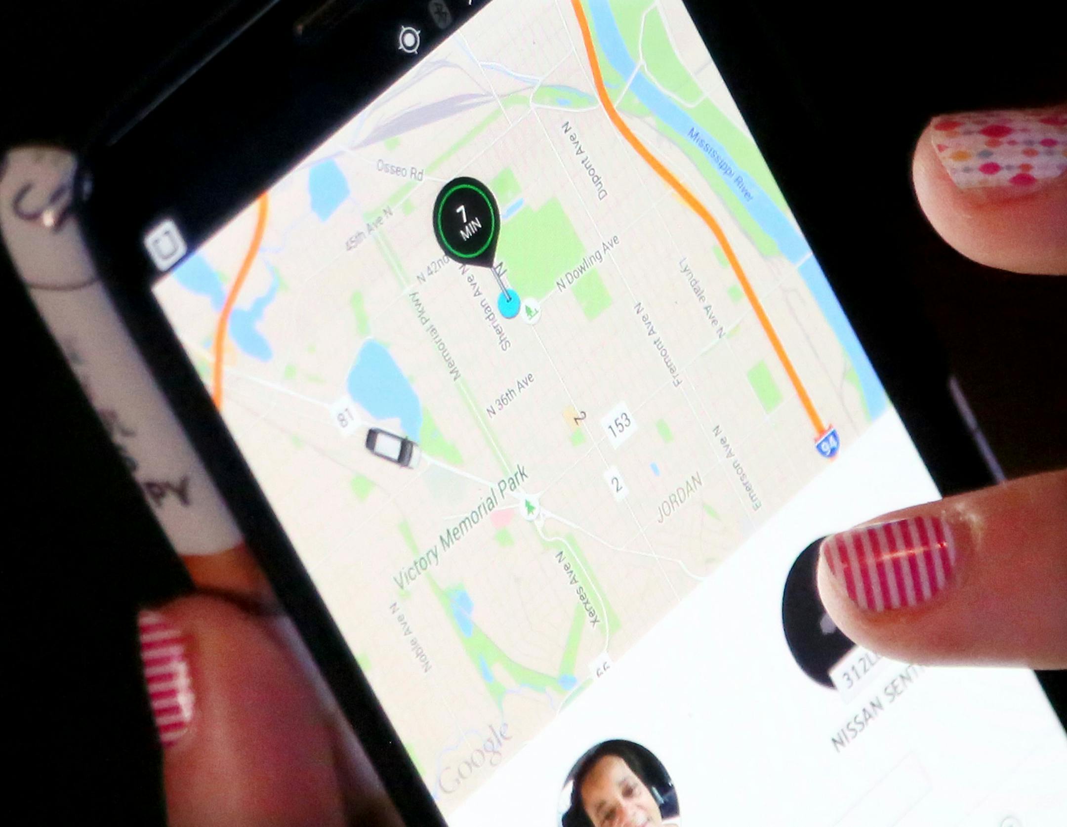 Jillian Nelson is among Uber customers who at times are having trouble getting rides in North Minneapolis. Here, Nelson checked the location of her Uber ride on her phone app Wednesday, Aug. 5, 2015, at her northside Minneapolis, MN., home.](DAVID JOLES/STARTRIBUNE)djoles@startribune.com Jillian Nelson is among Uber customers who at times are having trouble getting rides in North Minneapolis. In the recent past, Nelson has ordered a ride from Uber, only to have the driver cancel, requiring her t