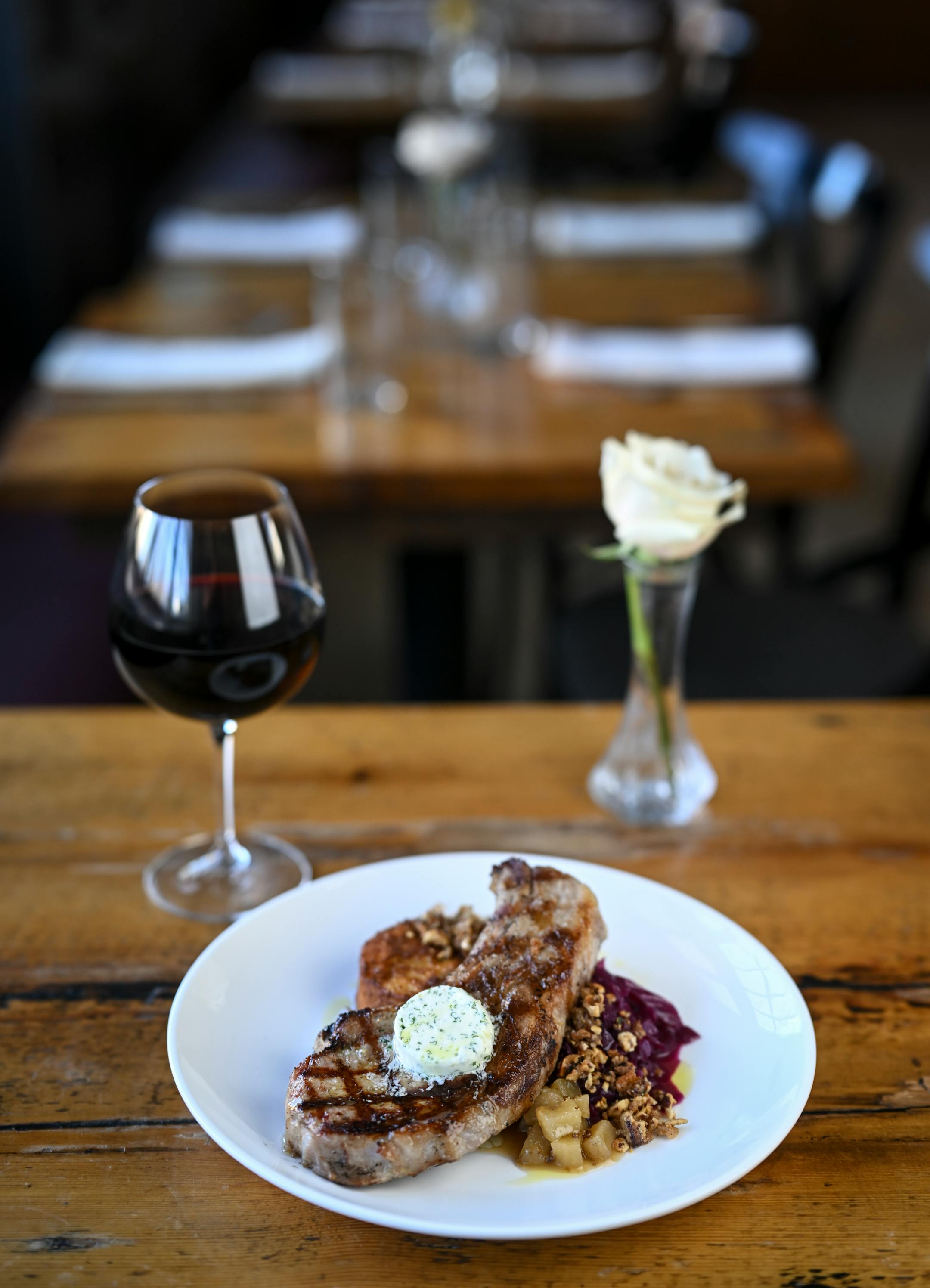 The pork chop with panisse, braised cabbage, pear and hazelnut pangrattato at The Kenwood.