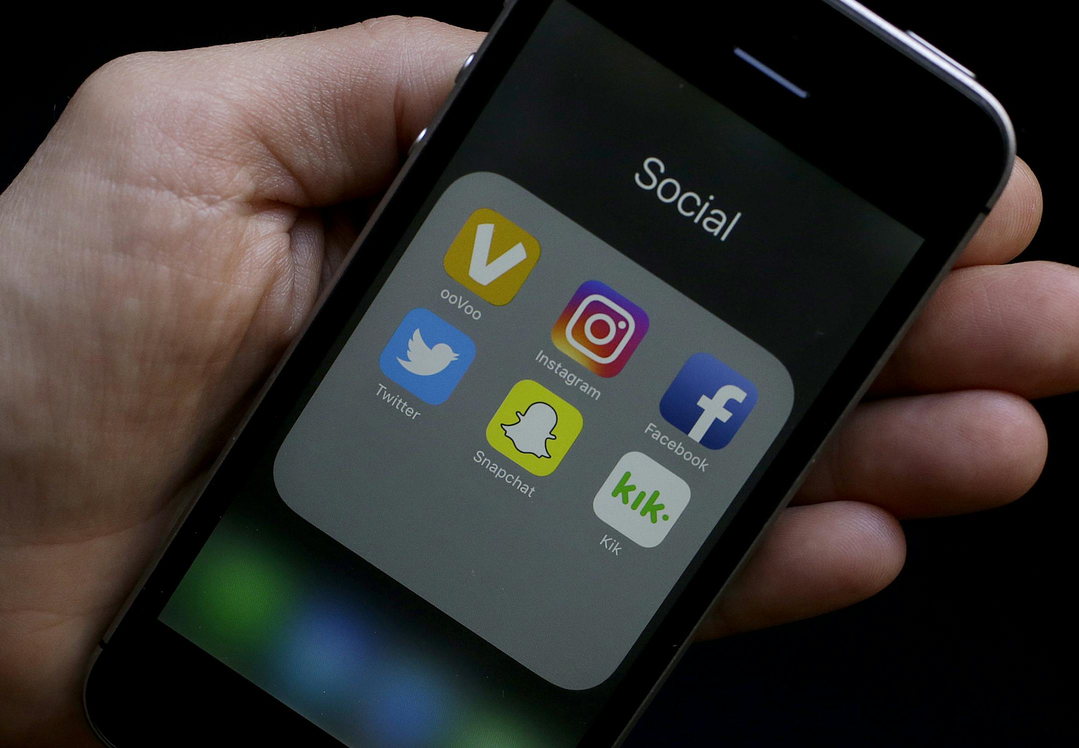 This June 16, 2017 photo shows social media app icons on a smartphone held by an Associated Press reporter in San Francisco. Google yourself. Curate your online photos. And as one private high school advises its students: Don't post anything online you wouldn't want your grandmother to see. AP spoke with experts on the role of social media in the college admissions process. They offered tips for students on what to post - and not post - if you're trying to get into college. (AP Photo/Jeff Chiu)