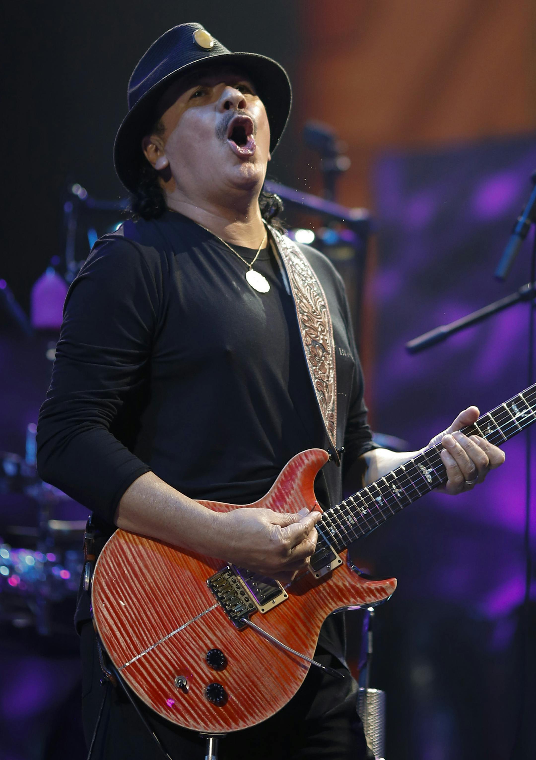 Carlos Santana early in his set Sunday night at Xcel Energy Center. ] JEFF WHEELER ‚Ä¢ jeff.wheeler@startribune.com Carlos Santana and Rod Stewart performed Sunday night, August 10, 2014 at Xcel Energy Center in St. Paul.