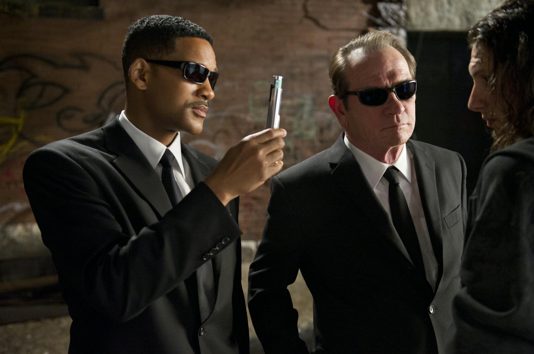 In this film image released by Sony, Will Smith, left, and Tommy Lee Jones are shown in a scene from "Men in Black 3." (AP Photo/Sony Pictures, Wilson Webb)