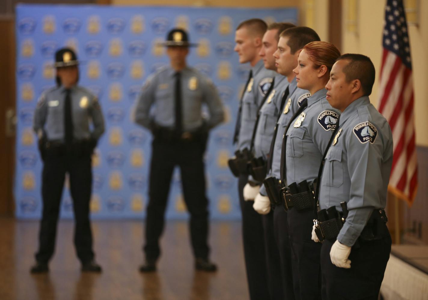 Half of the newly sworn officers in the newest class of Minneapolis Police Academy recruits awaited dismissal following their swearing in Wednesday evening. (Th other five members of the class were out of the frame to the right. ] JEFF WHEELER &#xef; jeff.wheeler@startribune.com Eight new members of the Minneapolis Police Department were sworn in Wednesday evening, June 1, 2016 in a ceremony at St. Mary's Greek Orthodox Church. In addition, two Park Police officers were sworn in, too. All were a