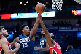New Orleans Pelicans forward Naji Marshall goes to the basket against Minnesota Timberwolves forward Nathan Knight (13) in the second half of an NBA b
