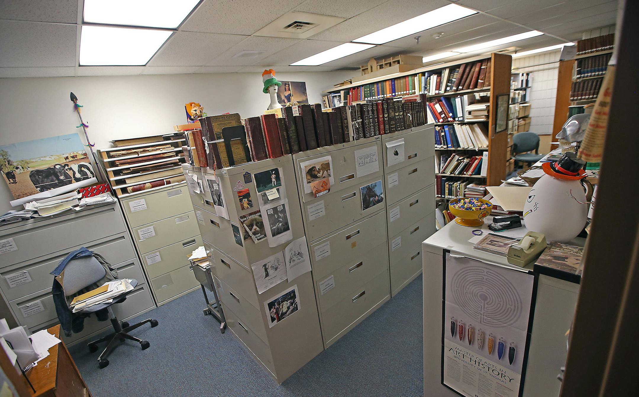 Matt Carter, the executive director of the Dakota County Historical Society gave a tour of the 40-year-old building, Tuesday, January 12, 2015 in South St. Paul, MN. A library is crammed with books and information also serves as an office for employees. ] (ELIZABETH FLORES/STAR TRIBUNE) ELIZABETH FLORES • eflores@startribune.com