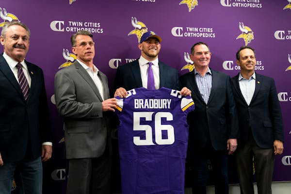 Vikings first-round pick Garrett Bradbury held his jersey with, from left, owner Zigi Wilf, general manager Rick Spielman, head coach Mike Zimmer, and