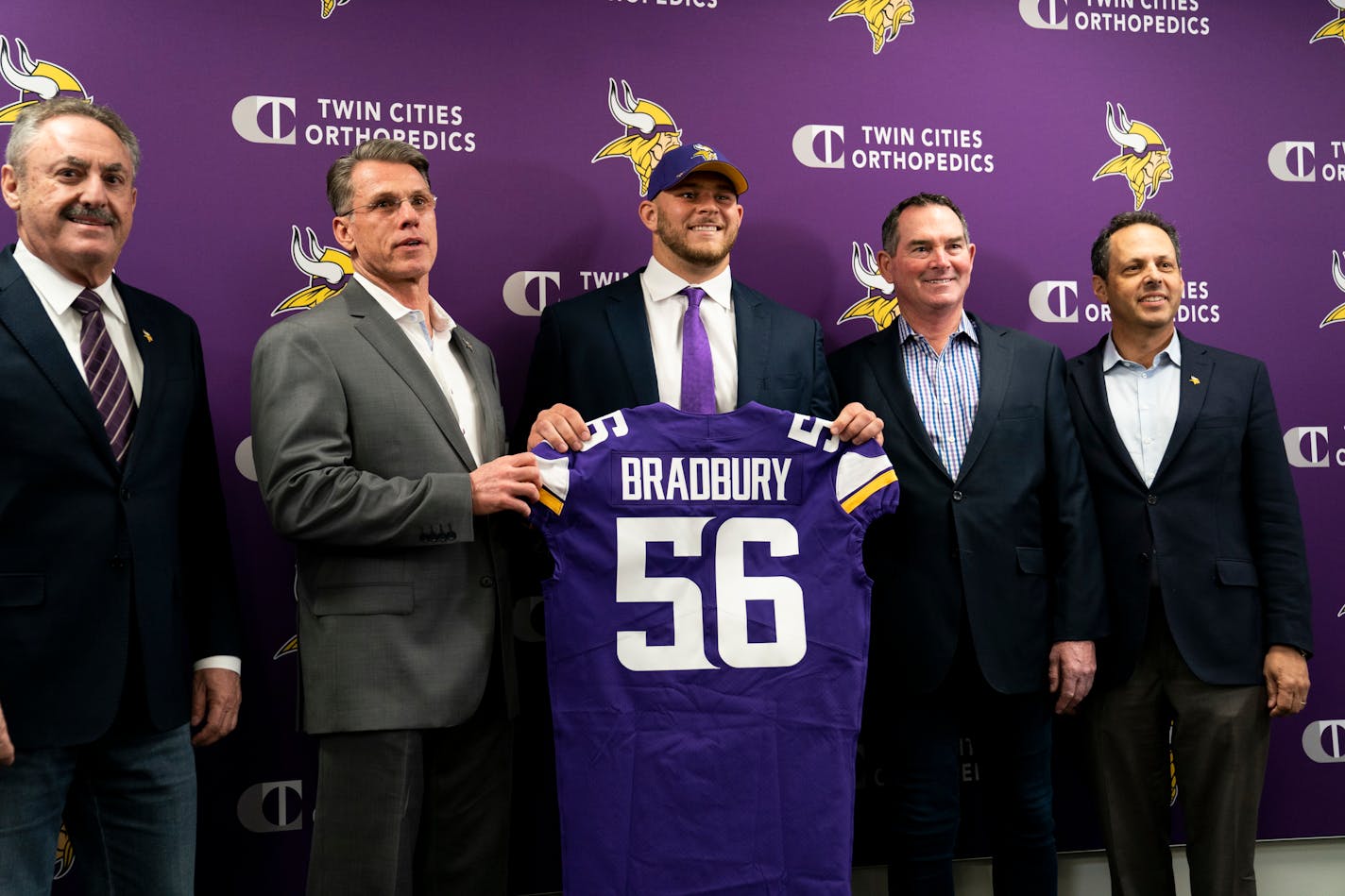 Vikings first-round pick Garrett Bradbury held his jersey with, from left, owner Zigi Wilf, general manager Rick Spielman, head coach Mike Zimmer, and owner Mark Wilf