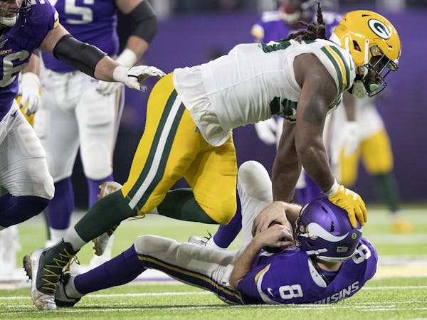 Green Bay's Za'darius Smith (55) sacked Vikings quarterback Kirk Cousins (8) in the fourth quarter of the Packers' 23-10 victory Monday night.