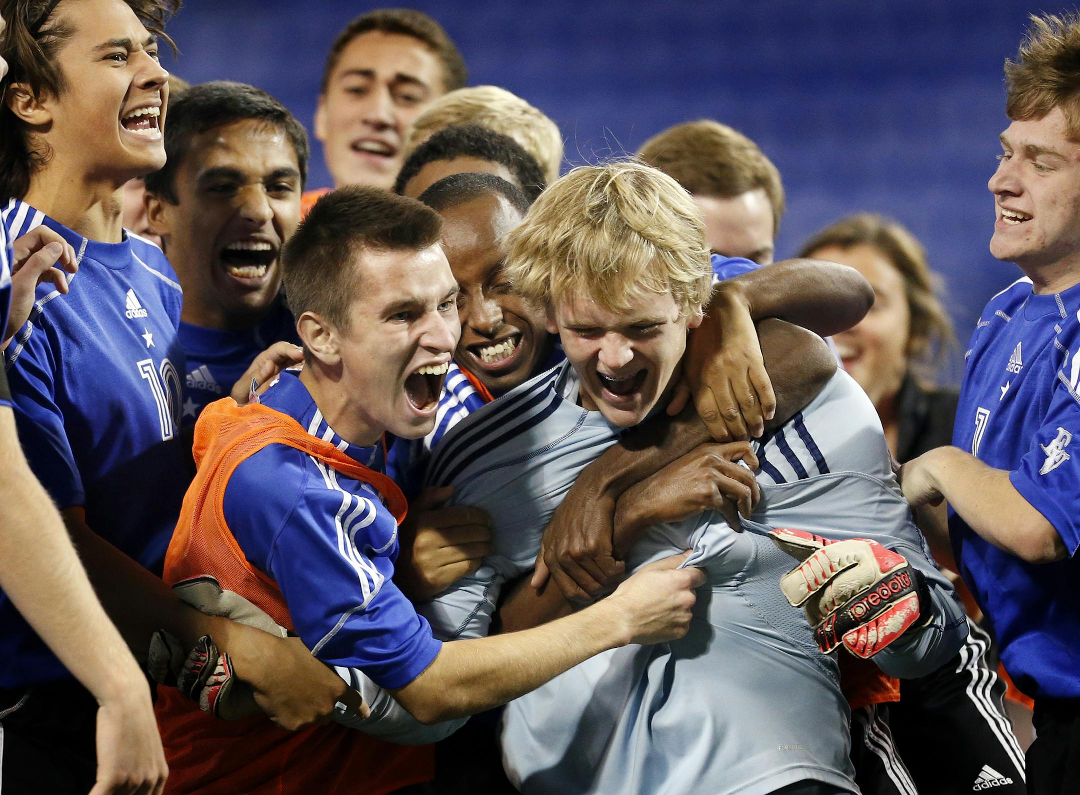 Eastview players celebrated around goalie Kyle Lamott (1) after defeating Edina in an overtime shootout. CARLOS GONZALEZ cgonzalez@startribune.com