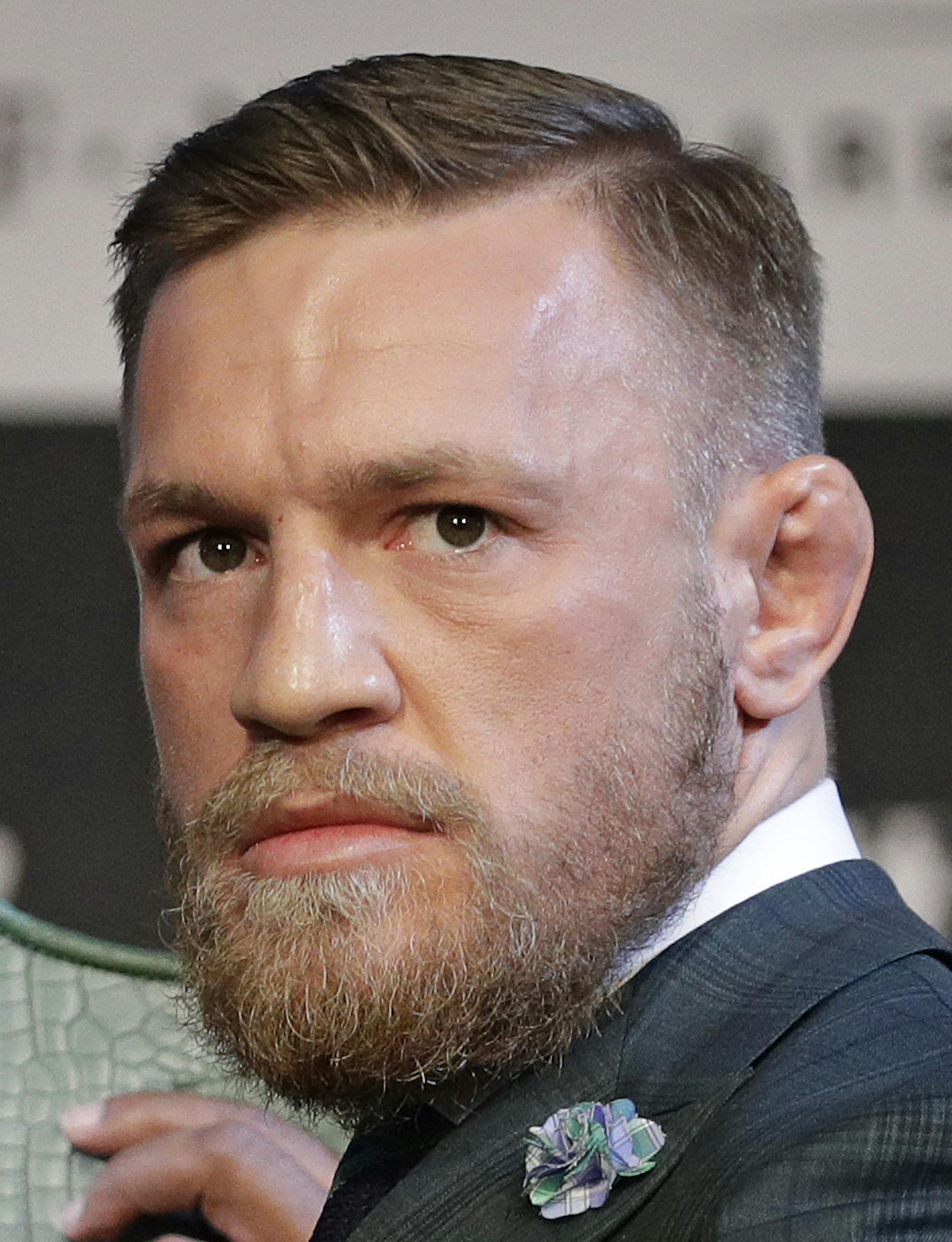 Floyd Mayweather Jr., left, and Conor McGregor pose for photographers during a news conference Wednesday, Aug. 23, 2017, in Las Vegas. The two are scheduled to fight in a boxing match Saturday in Las Vegas. (AP Photo/John Locher)