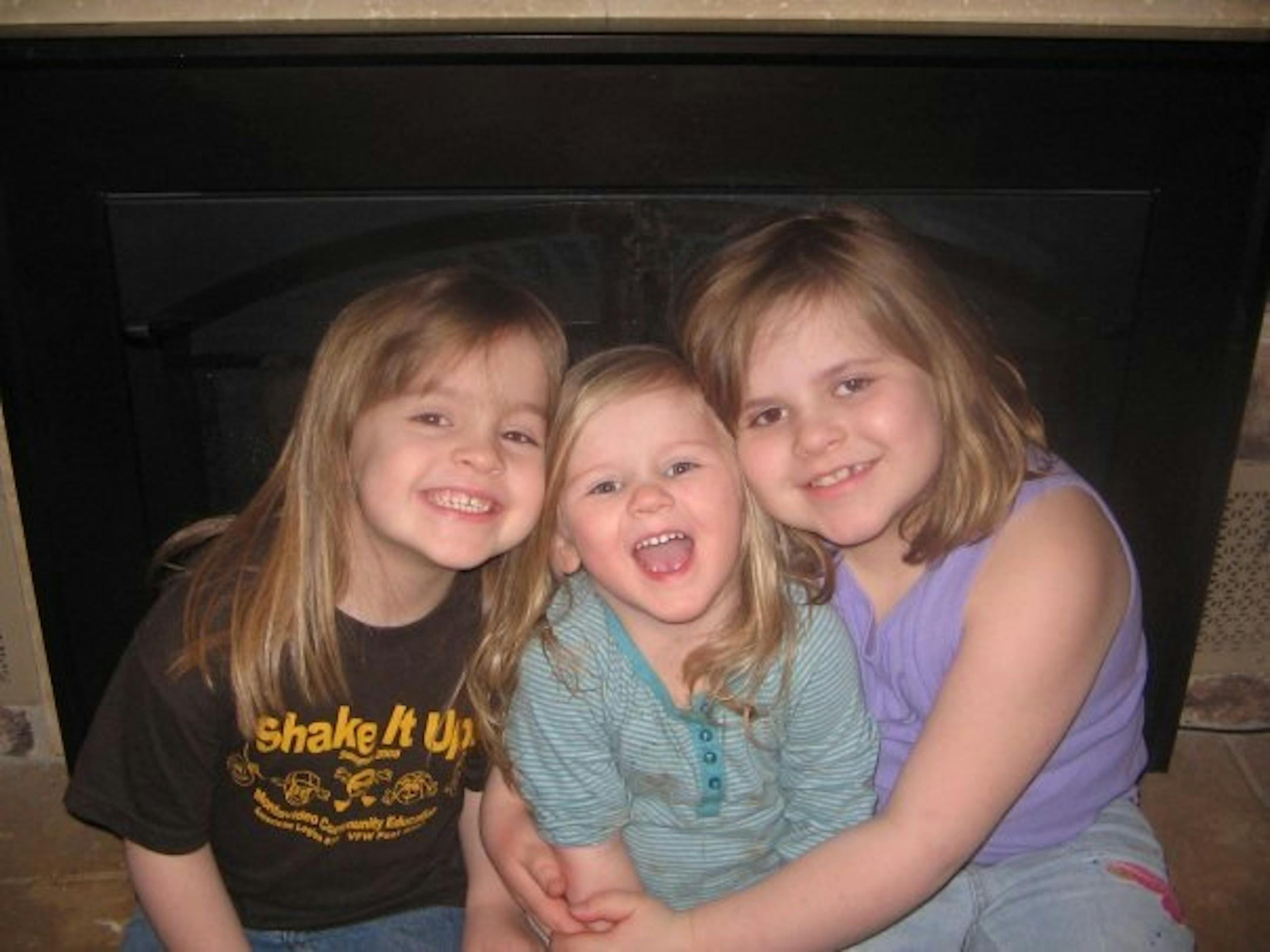 Katelyn, center, with sisters Kassey and Kaylee, before her illness.