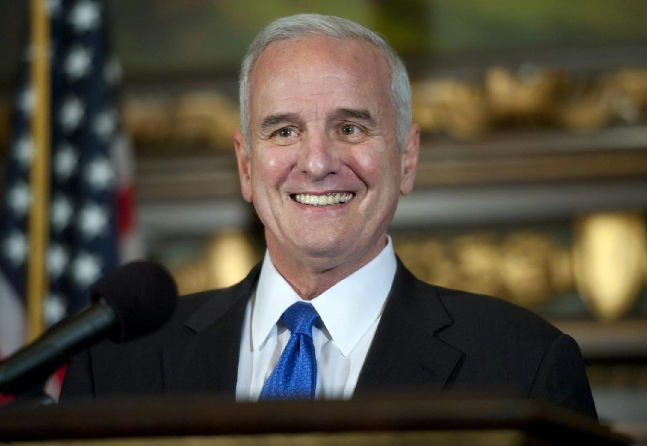Gov. Mark Dayton talked to reporters about the state's projected $876 million budget surplus on Thursday.