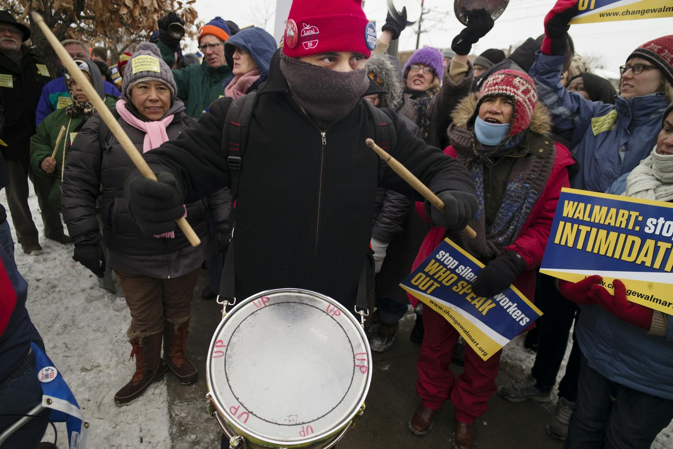 At the Walmart near the intersection of Snelling and University in St. Paul, protesters including Julio Fernandez, who was beating the drum for better wages and working conditions from the giant retailer.