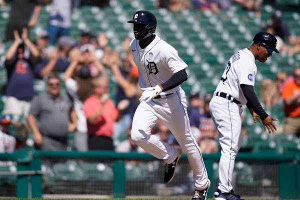 Detroit’s Daz Cameron rounded the horn after a two-run home run in the eighth inning against the Twins on Thursday at Comerica Park.