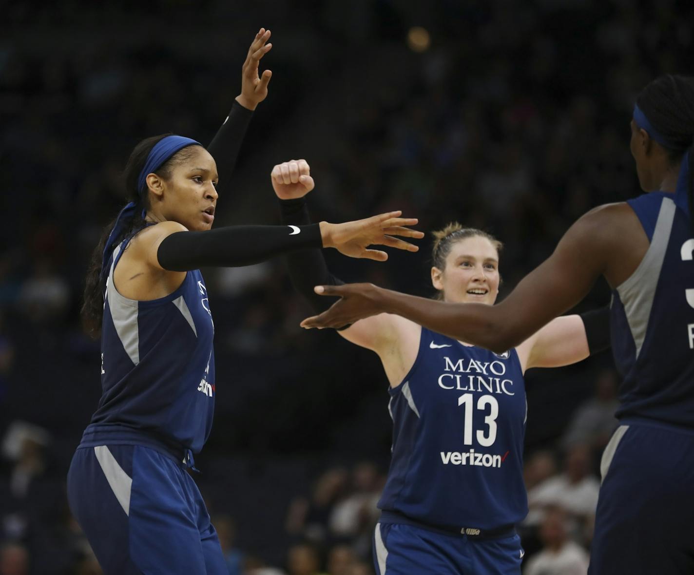 Lynx forward Maya Moore, left, and guard Lindsay Whalen congratulated Sylvia Fowles on drawing a fourth quarter foul.