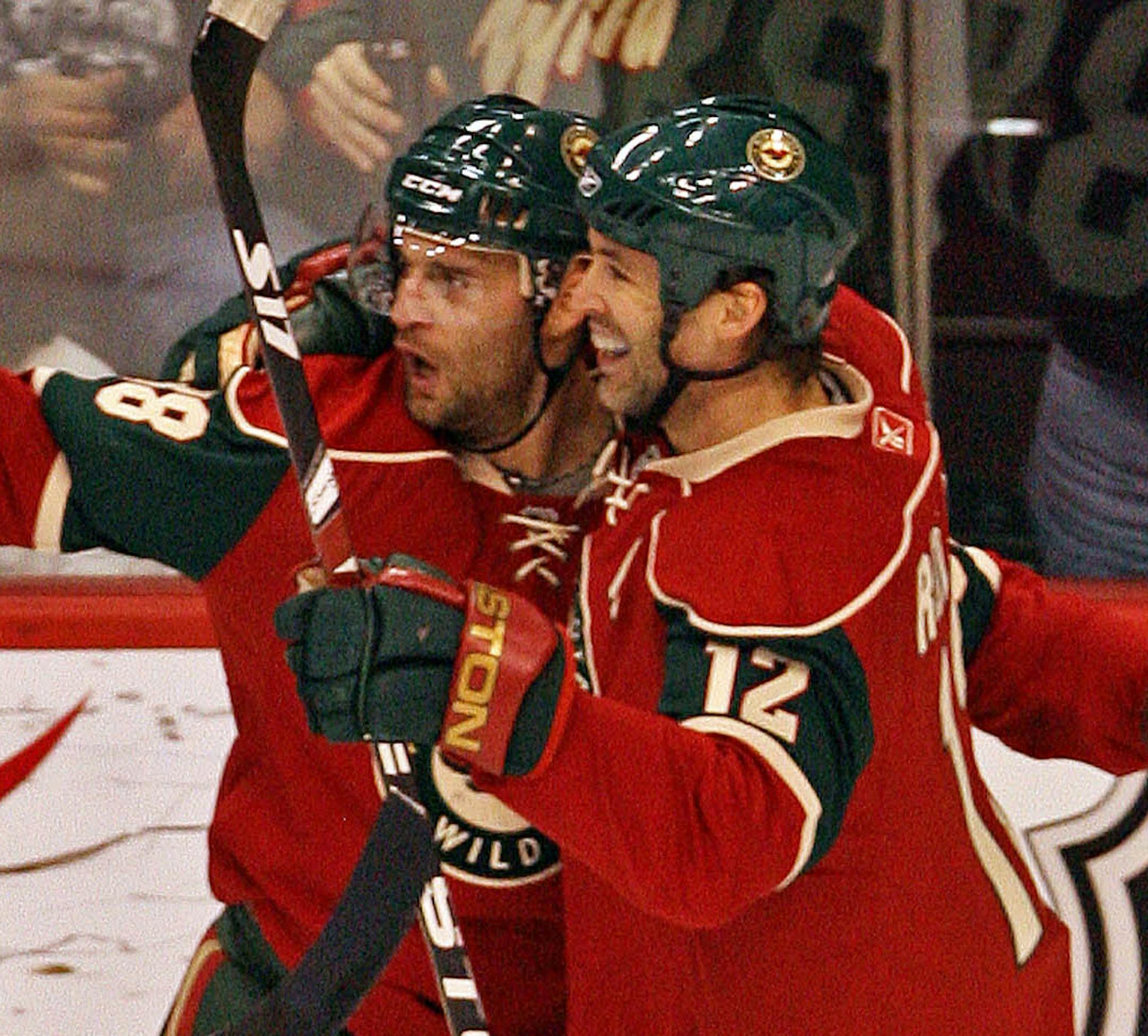 MARLIN LEVISON * mlevison@startribune.com Assign. #111912 St.Paul, MN January 13, 2008] GENERAL INFORMATION: Wild vs. Phoenix IN THIS PHOTO: Pavol Demitra, center is congratulated by teammate Brian Rolston #12 after Demitra scored the first goal of the game in the 2nd period.