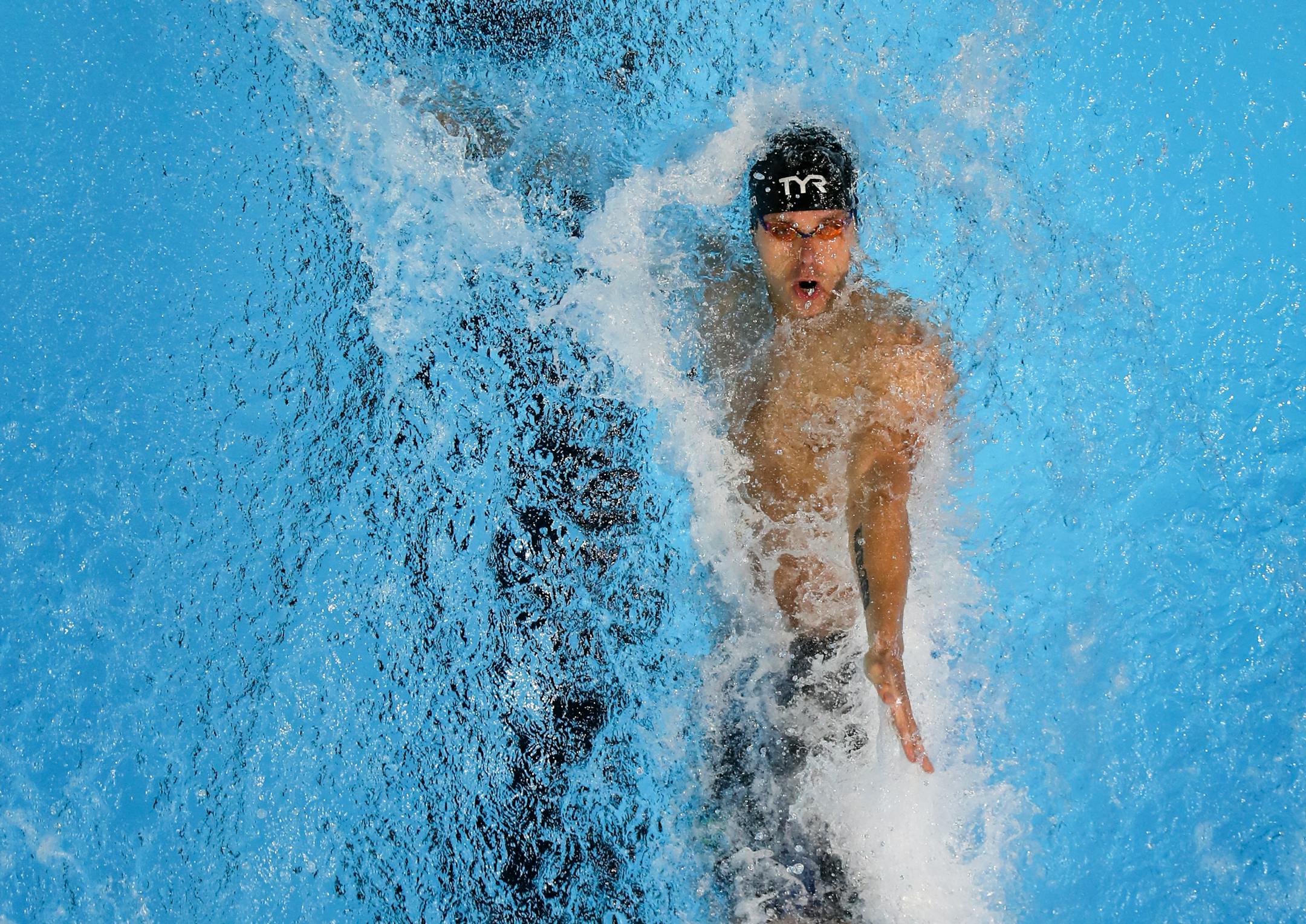 David Plummer, of Minneapolis, put himself in position Monday to qualify for the Olympics in the 100-meter backstroke.