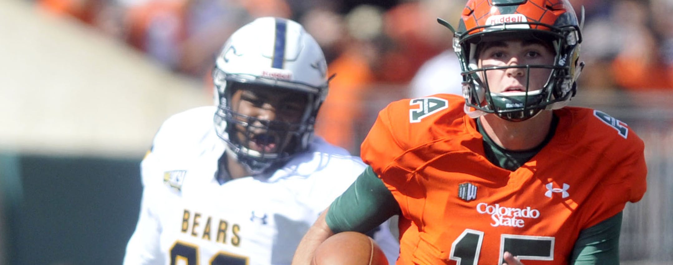 Colorado State's Collin Hill sprints away from Northern Colorado's Michael McCauley during an NCAA college football game Saturday, Sept 17, 2016, in Fort Collins, Colo.(Joshua Polson/The Greeley Tribune via AP) ORG XMIT: COGRE103