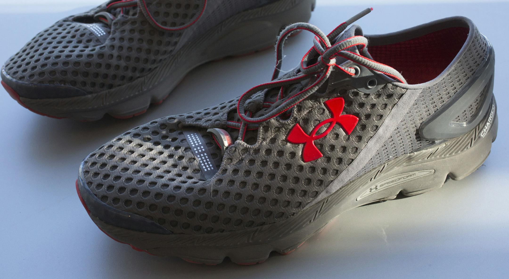 FILE - In this Monday, Jan. 4, 2016, file photo, a pair of Under Armour SpeedForm Gemini 2 Record Equipped running shoes, containing an embedded chip to track exercise, are displayed in New York. Under Armour Inc. reports earnings Tuesday, Oct. 31, 2017. (AP Photo/Mark Lennihan, File)