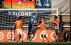 Minnesota United goalkeeper Bobby Shuttleworth (33) made a save off a corner kick in the first half Saturday against the Houston Dynamo. ] AARON LAVIN