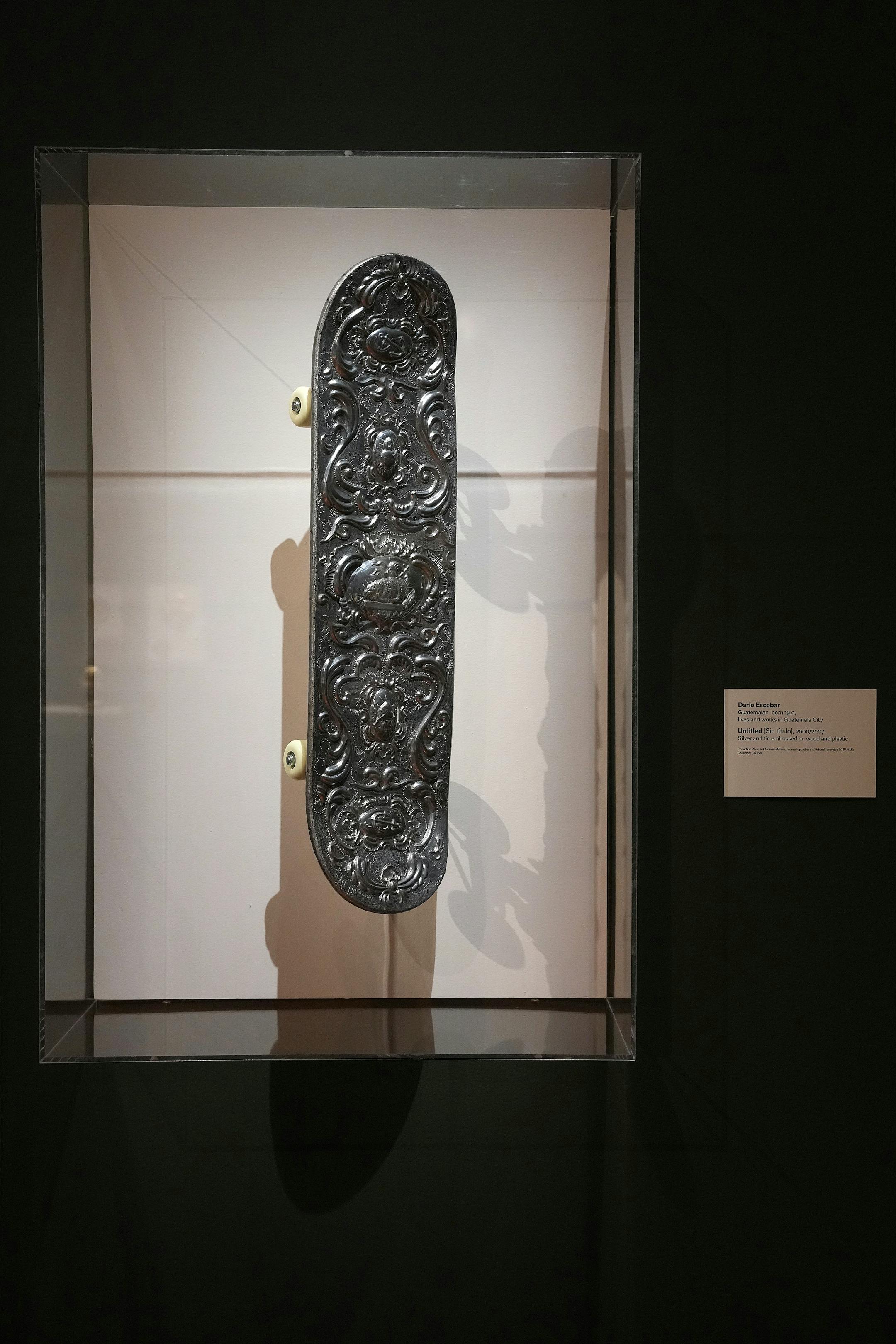 An untitled piece of silver and tin embossed on the wood and plastic of a skateboard by Dario Escobar hangs in the new ReVisión: Art in the Americas exhibit during a press preview Thursday, June 29, 2023 at the Minneapolis Institute of Art in Minneapolis. ] ANTHONY SOUFFLE • anthony.souffle@startribune.com