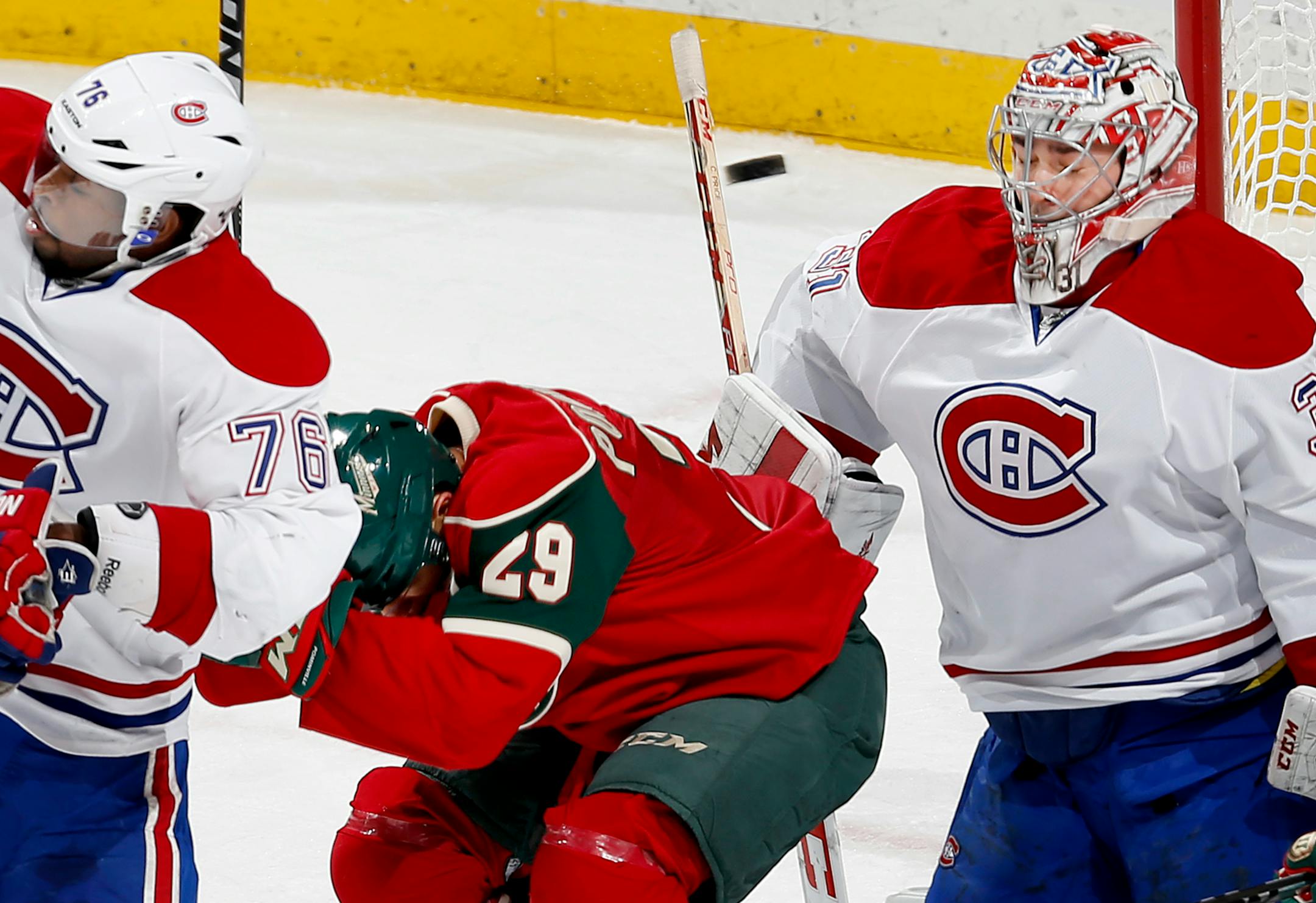 Jason Pominville (29) ducked out of the way of a puck as it went on to pass goalie Carey Price (31) for a goal in the second period. Pominville was credited for the goal.