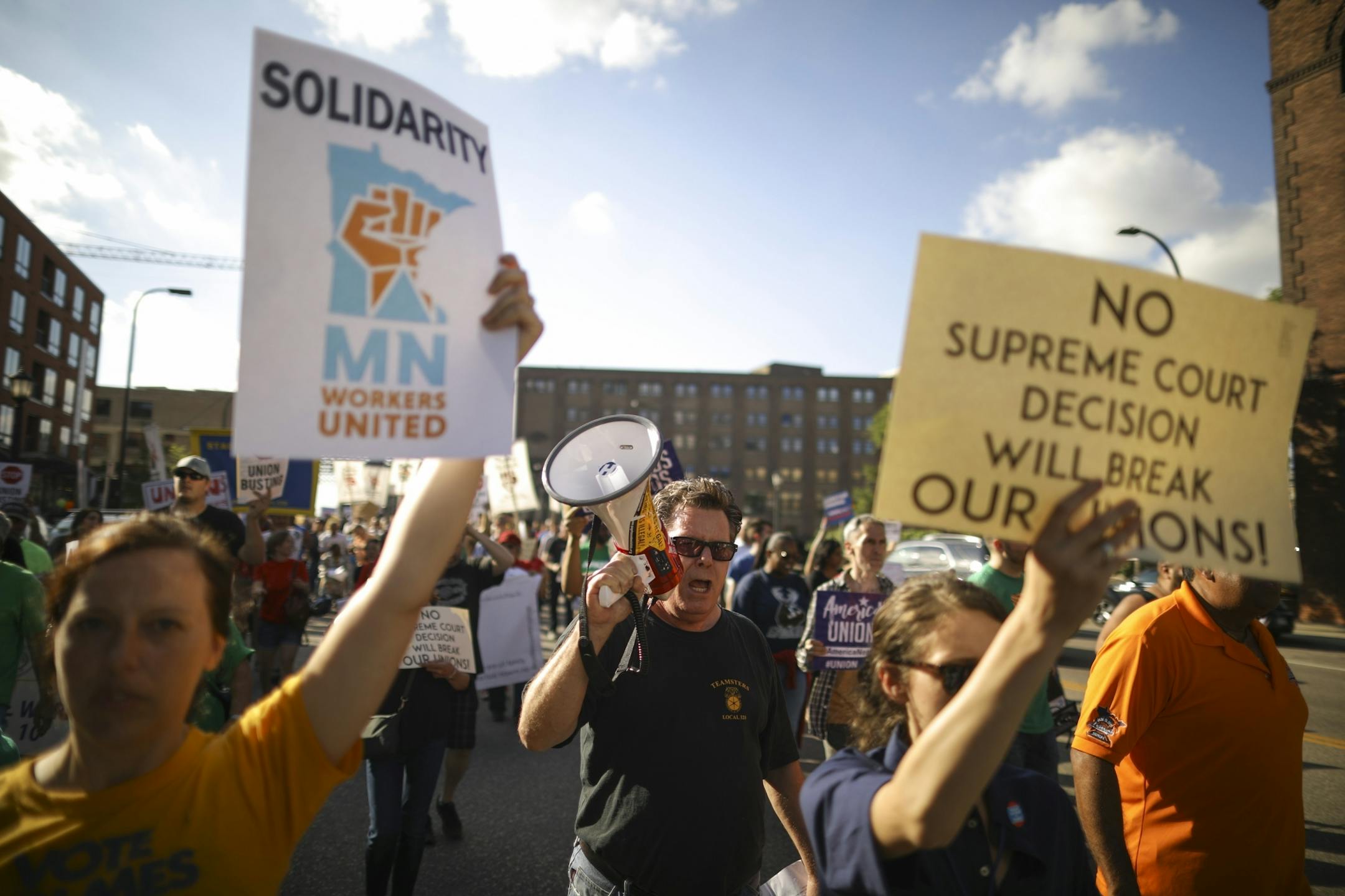 The union workers and their supporters chanted slogans as they marched on Washington Ave. to the U.S. Federal Courthouse.