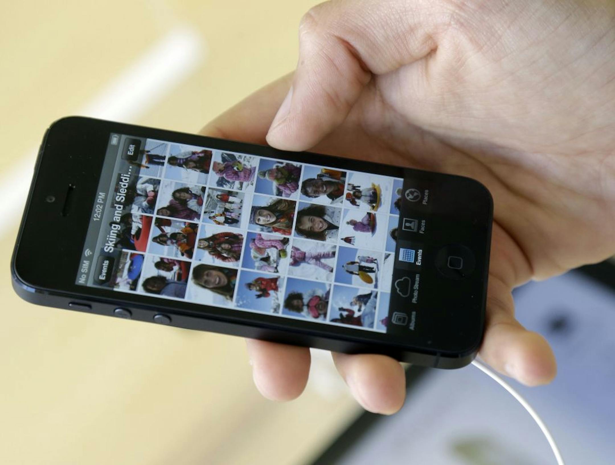 A costumer sets up an iPhone 5 at an Apple store in San Francisco, Friday, Sept. 21, 2012.