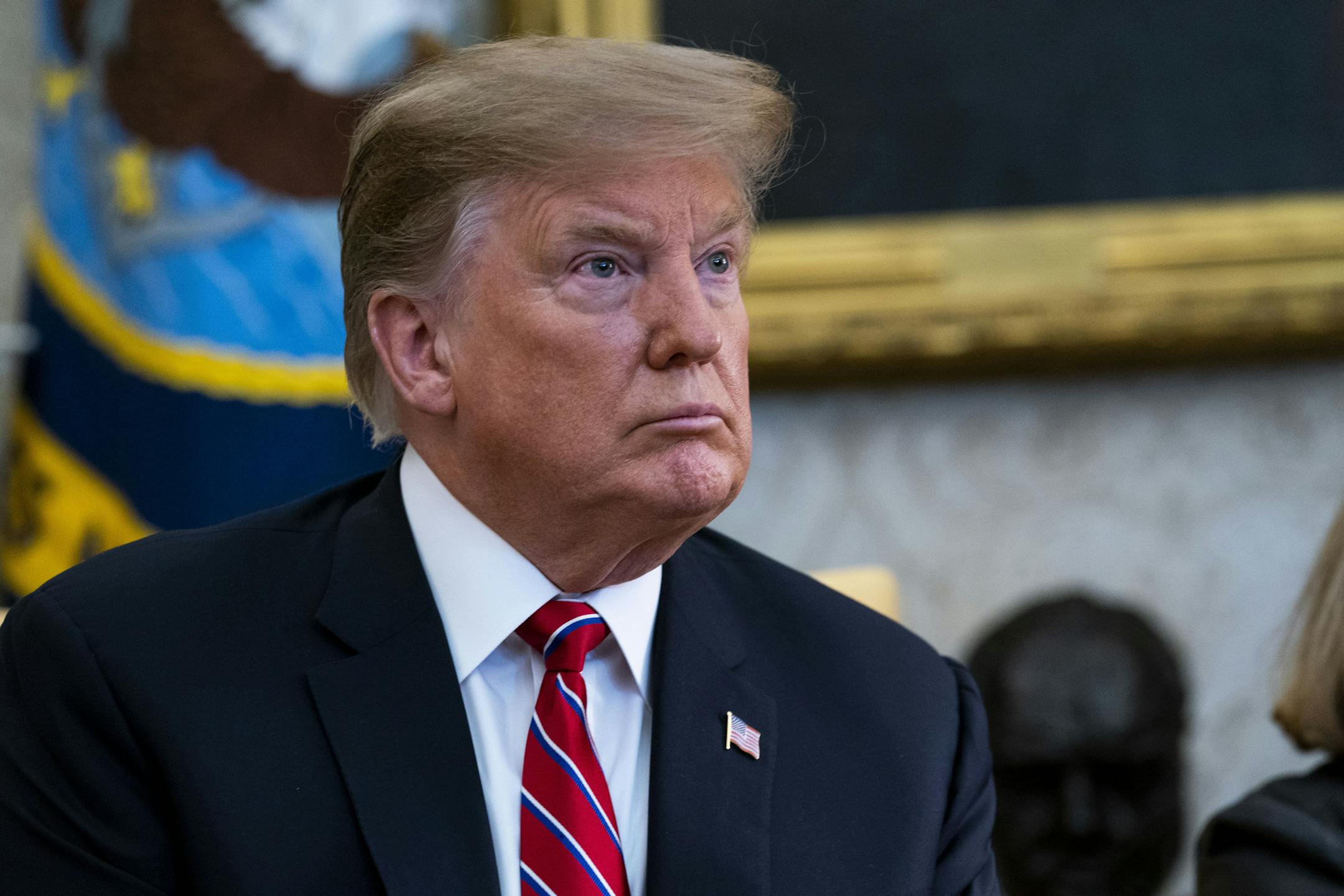 President Donald Trump speaks to reporters during a meeting with President Jair Bolsonaro of Brazil in the Oval Office at the White House, in Washington, March 19, 2019. Trump said on Tuesday that he was “never a fan” of the late Sen. John McCain, “and I never will be.” The president’s blunt remarks came in response to a reporter’s question about his recent attacks on the Republican war hero who represented Arizona, and who died last year of brain cancer