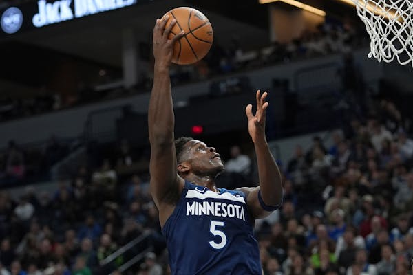 Timberwolves guard Anthony Edwards went to the net during the first half against the Magic on Friday at Target Center, but his missed three-pointer wi