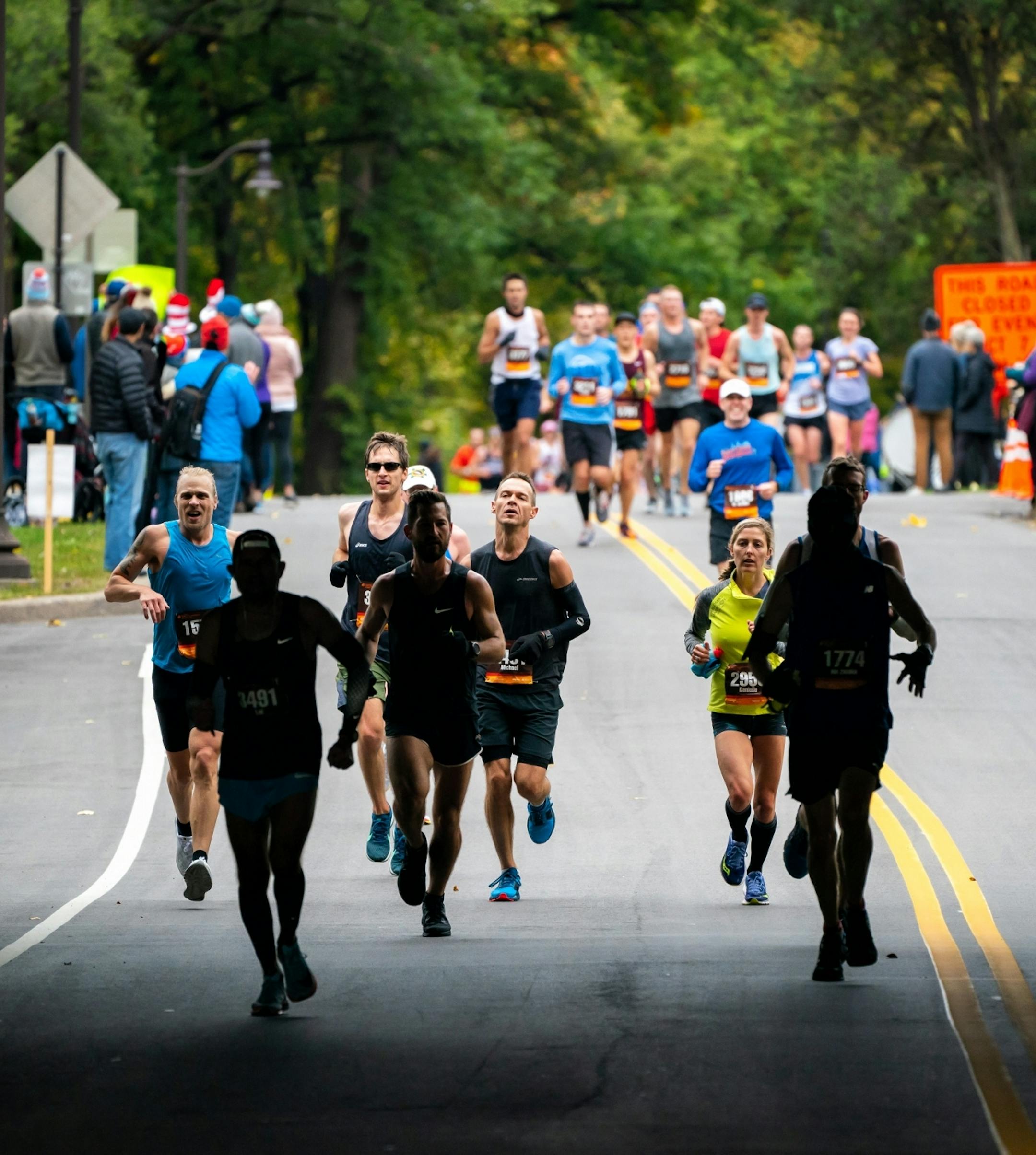 Runners passed under the Lake St Bridge on West River Parkway between 17 and 18 mile marker during the Twin Cities Marathon.