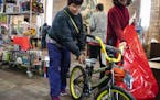 Thwanda Thomas of Minneapolis picked out a bike for her 7-year-old at the Salvation Army Toy Shop on Wednesday, Dec. 18.