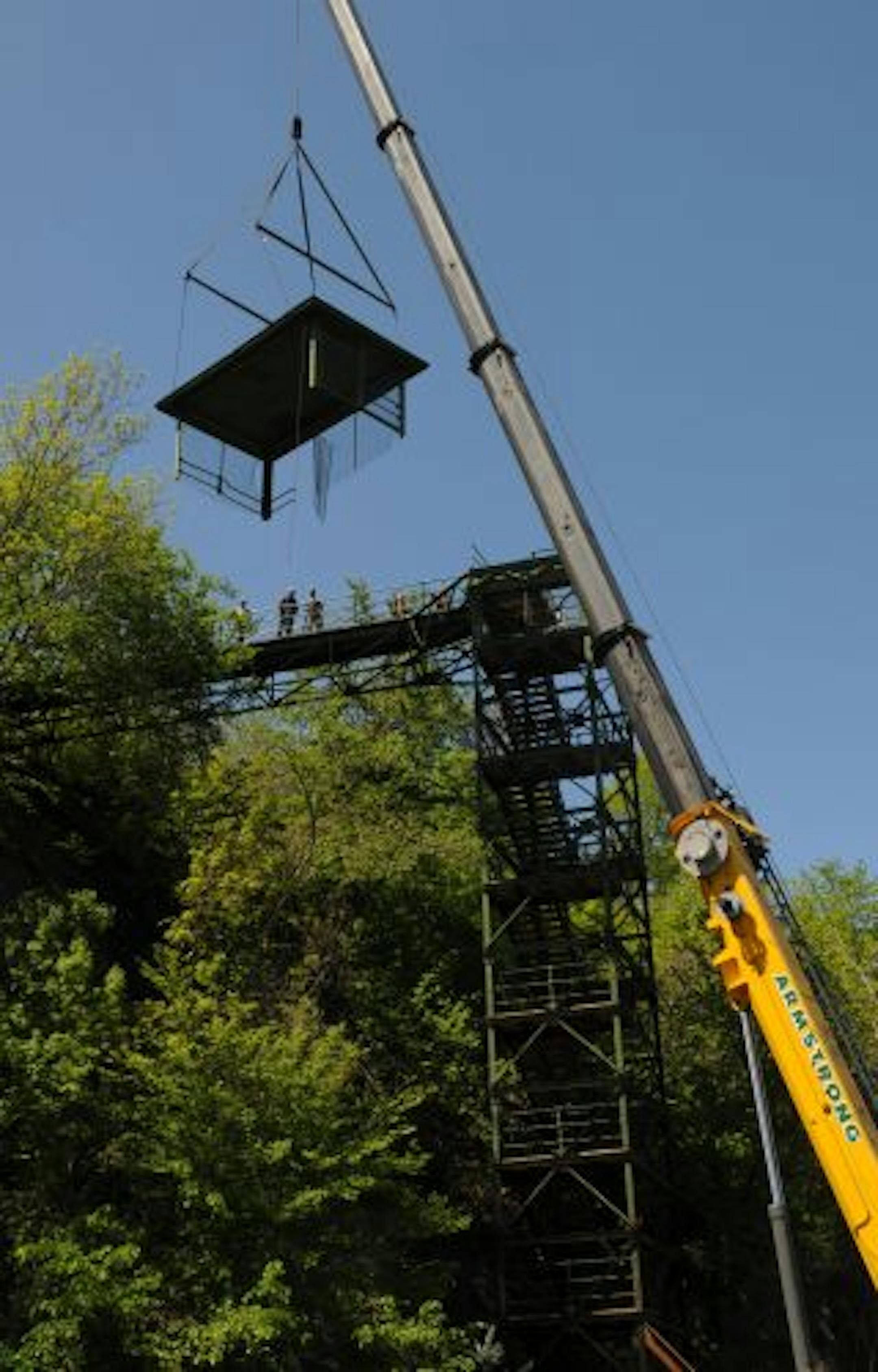 Construction crews from Bolander & Sons salvaged the roof section, which is the only sectiont that will be saved. A nearly 100-year-old staircase that connected the West Side bluffs to the flats and served as a training device for many will be deconstructed over the next day or two because a boulder crashed into it and made it unstable.Crews from Bolander & Sons began the dismantling process this ancient staircase along Wabasha St in St Paul, Mn.