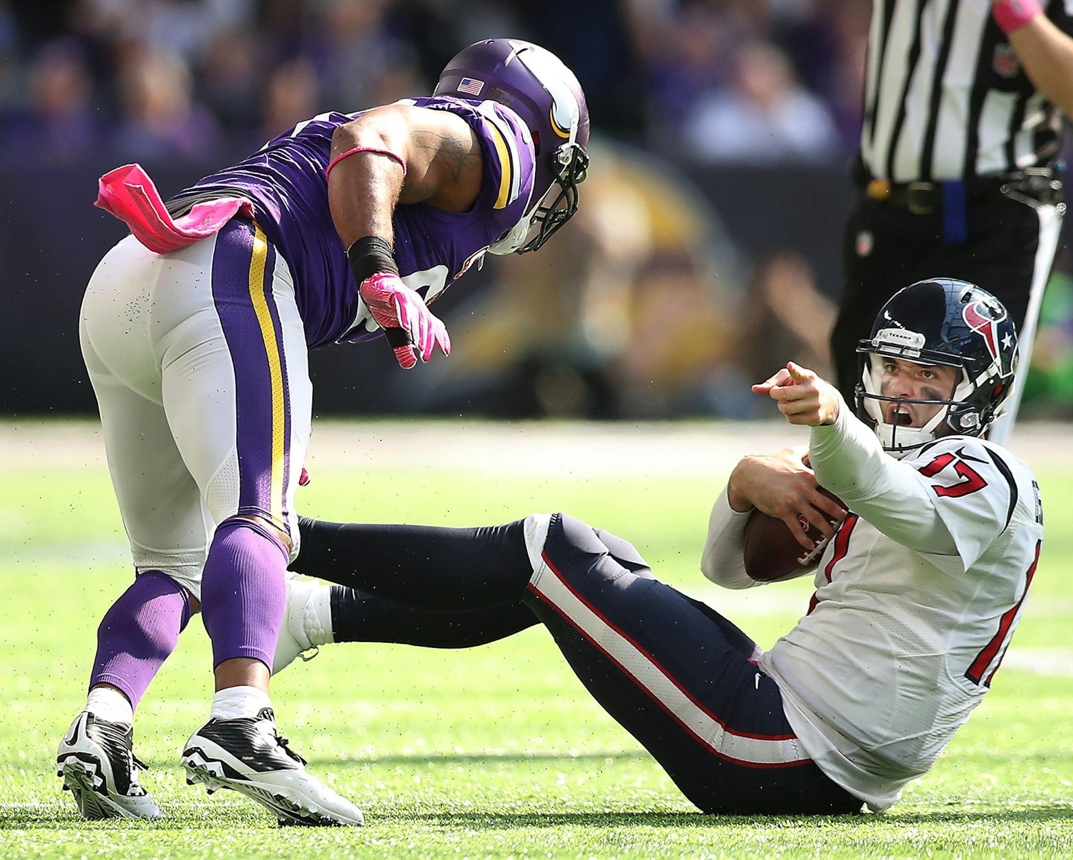 Houston Texans quarterback Brock Osweiler looks for a penalty call on outside linebacker Anthony Barr as he gets pressure by Minnesota Vikings defensive end Everson Griffen in the second quarter as they took on the Houston Texans at US Bank Stadium, Sunday, October 9, 2016 in Minneapolis, MN. ] (ELIZABETH FLORES/STAR TRIBUNE) ELIZABETH FLORES • eflores@startribune.com