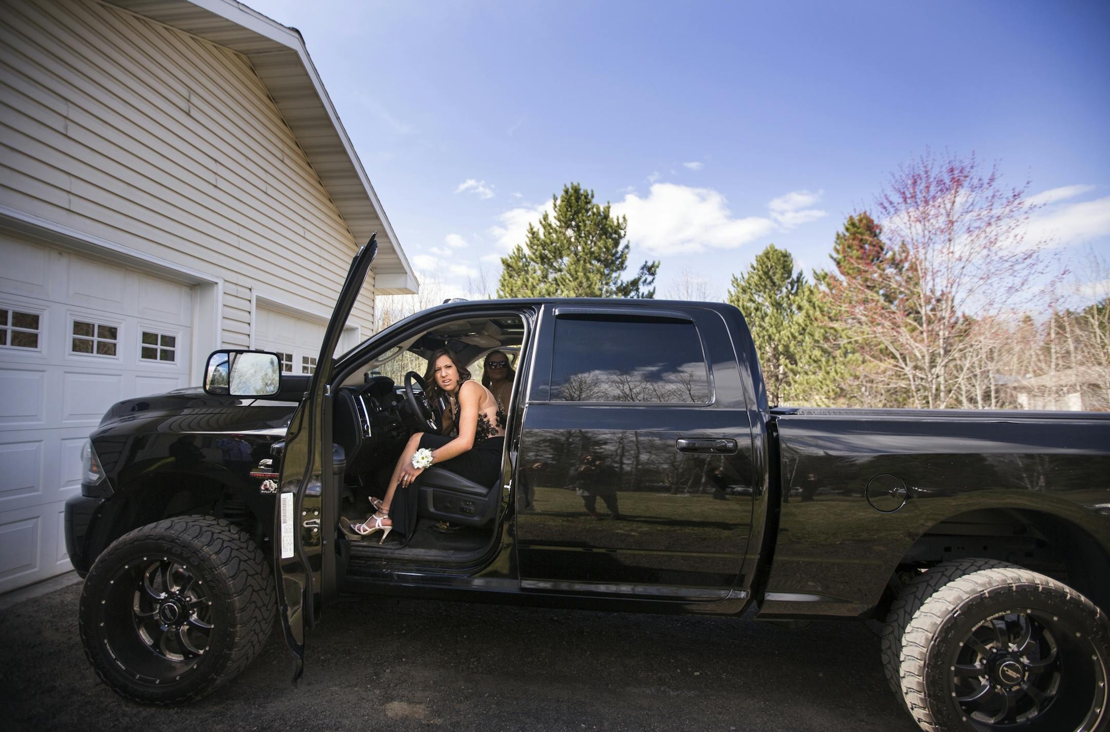 Baylee Hilfers borrows her older brother's truck to drive her friends to prom from her home in Fayal.