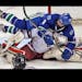 Eagan's Max Eisenheimer gets up close and personal with Duluth East goalie Gunnar Howg in 2nd period action. ] Boys State Highschool Hockey Tournament