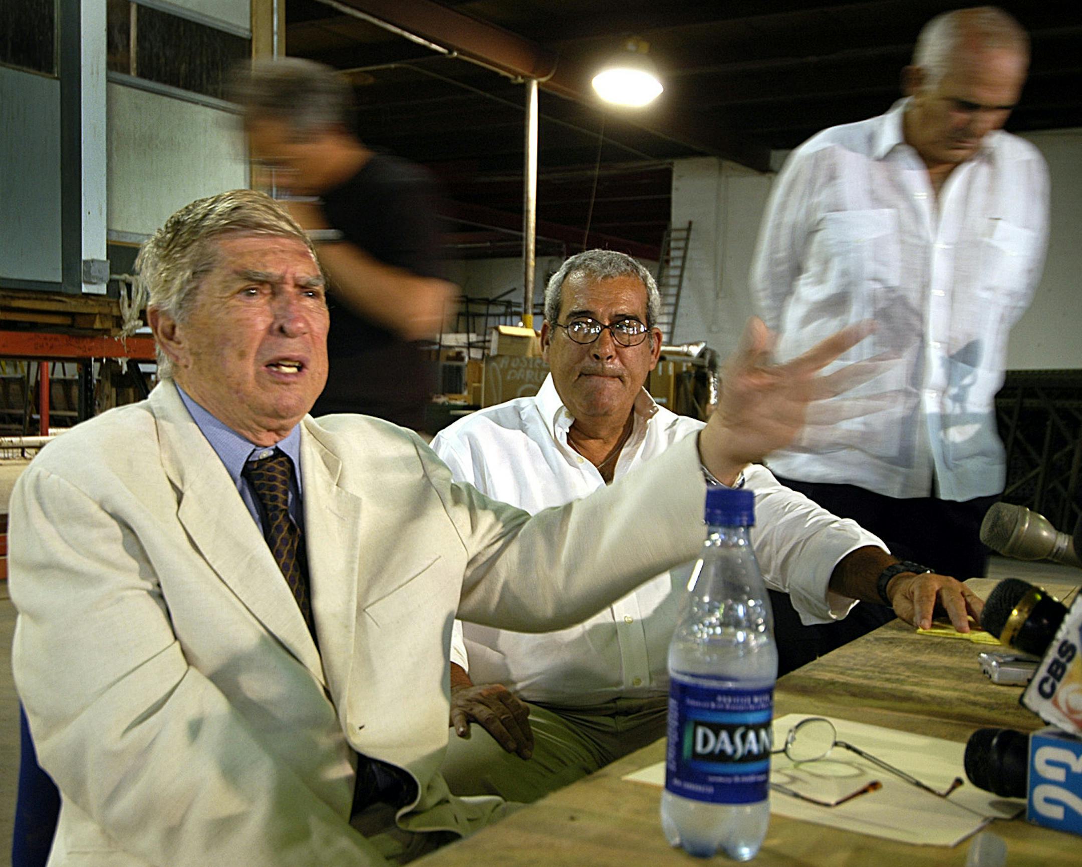 Luis Posada Carriles, left, speaks out against Fidel Castro and says he had nothing to do with the bombing of a Venezuelan airliner in 1976 at a press conference on Tuesday, April 17, 2005 at a secret location in Miami, Fla. Carriles died on May 23, 2018 at age 90. (Tim Chapman/Miami Herald/TNS) ORG XMIT: 1231885