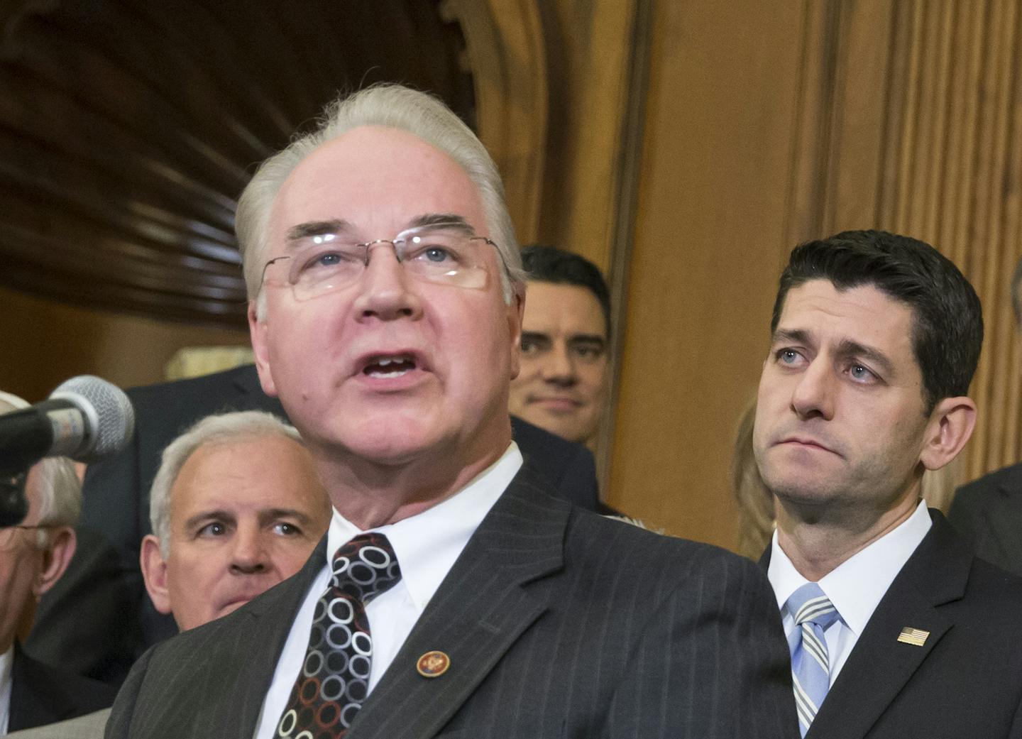 FILE - In this Jan. 7, 2016 file photo, Health and Human Services Secretary-designate Rep. Tom Price, R-Ga., speaks on Capitol Hill in Washington as House Speaker Paul Ryan of Wis. listens at right. Price says he will sell off stock holdings to avoid any conflicts of interest, or the appearance of a conflict. (AP Photo/J. Scott Applewhite, File)