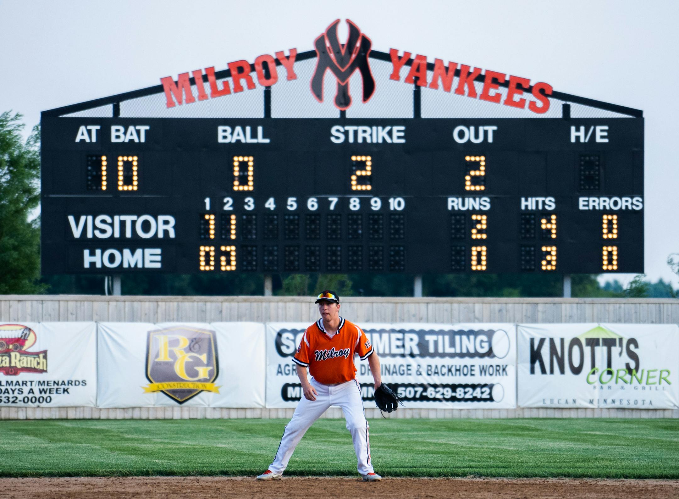 Yankees' Aaron Mathiowetz moves toward the infield during a play against Spicer at Yankee Field. ] MARK VANCLEAVE • Milroy, Minn. has two town team baseball teams: the Yankees and the Irish. The split followed a family feud and now the teams play at two separate ballparks five miles apart. Photographed on Friday, June 8, 2018.