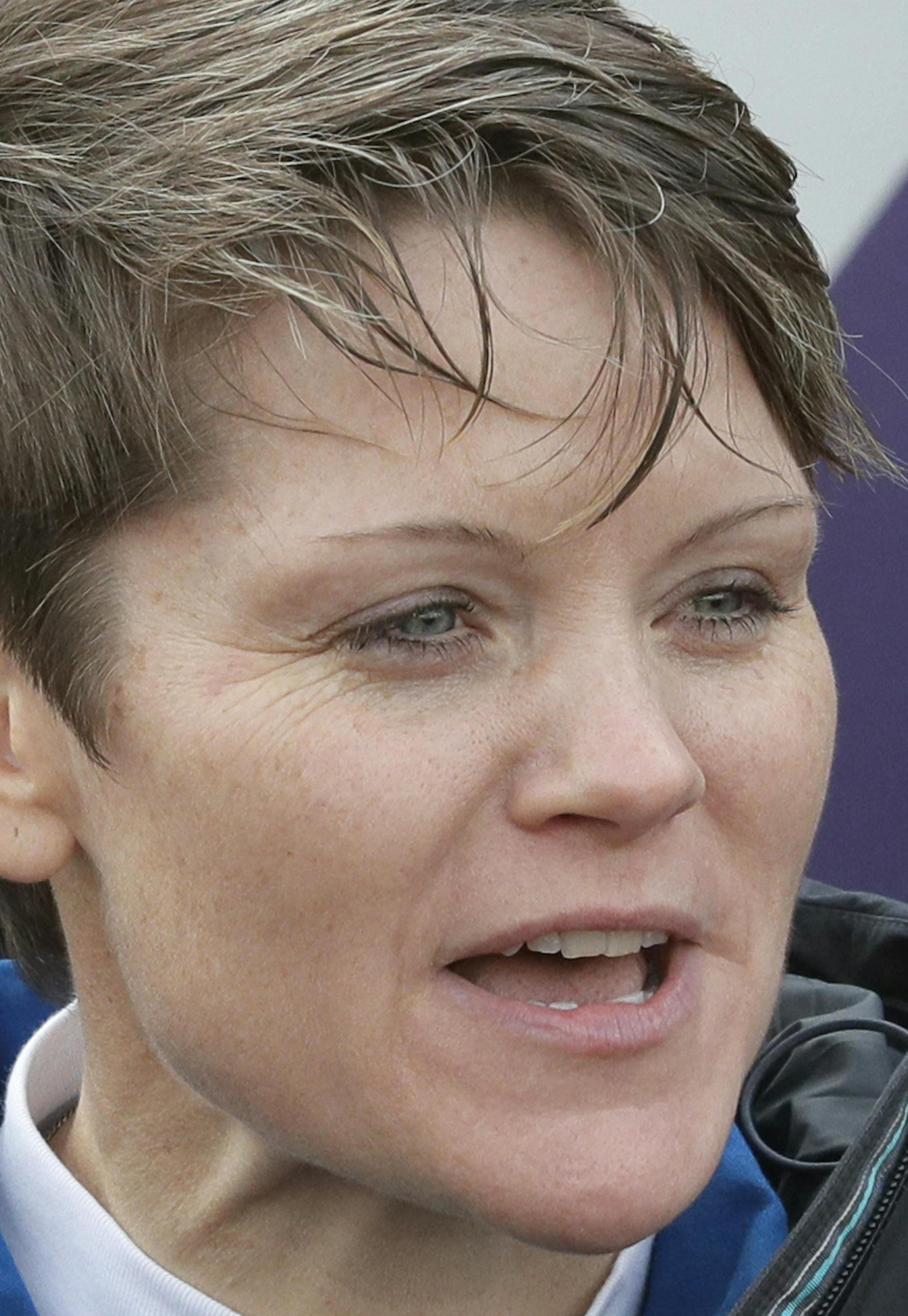 U.S. astronaut Anne McClain, a member of the main crew to the International Space Station (ISS), gestures to her relatives walking to a bus prior to the launch of Soyuz-FG rocket at the Russian leased Baikonur cosmodrome, Kazakhstan, Monday, Dec. 3, 2018. (AP Photo/Dmitri Lovetsky)