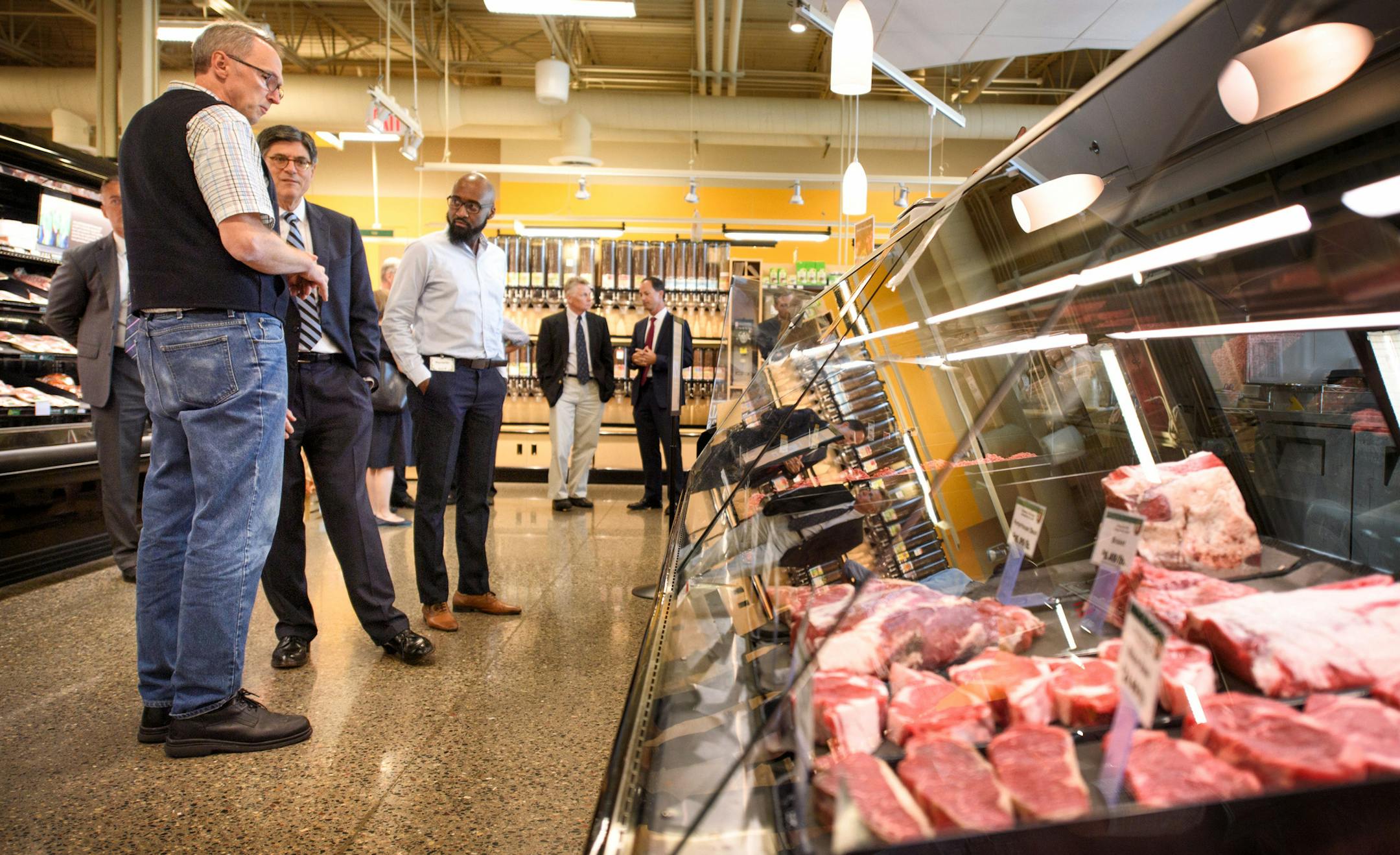 Jack Lew, center with Ray Williams, right, Seward Co-Op Store Manager and meat manager Karl Gerstenberger, left. Jack Lew, Obama's Treasury secretary, is in town to talk about the U.S. economy and the New Markets Tax Credit program, which helped fun the new Seward Co-Op Friendship Store on 38th Street. ] GLEN STUBBE * gstubbe@startribune.com Monday, August 8, 2016