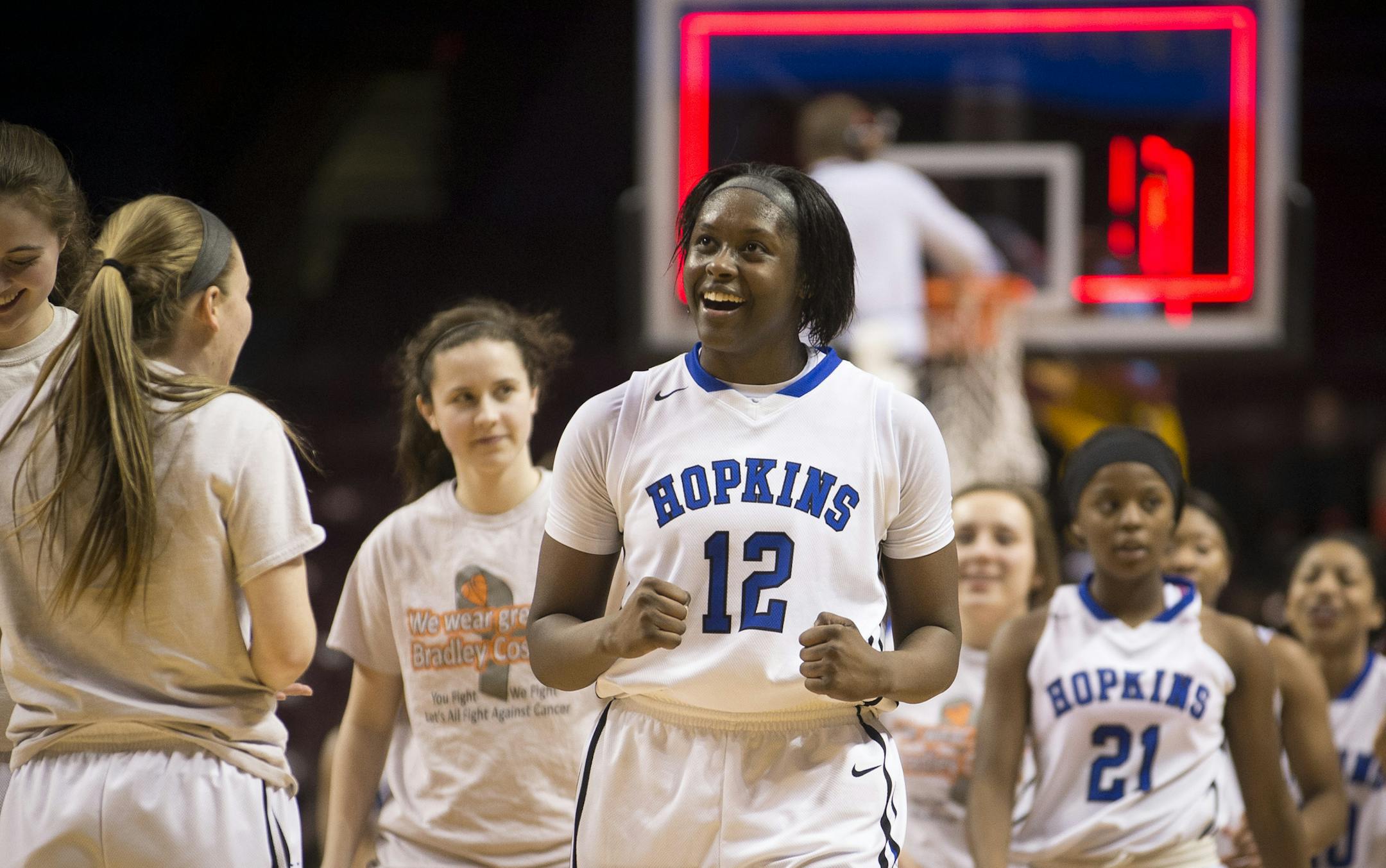 Hopkins guard Nia Hollie, center, celebrated the Royals’ 68-60 victory over Eastview in the Class 4A girls’ basketball championship game. Hollie scored 26 points in the final.