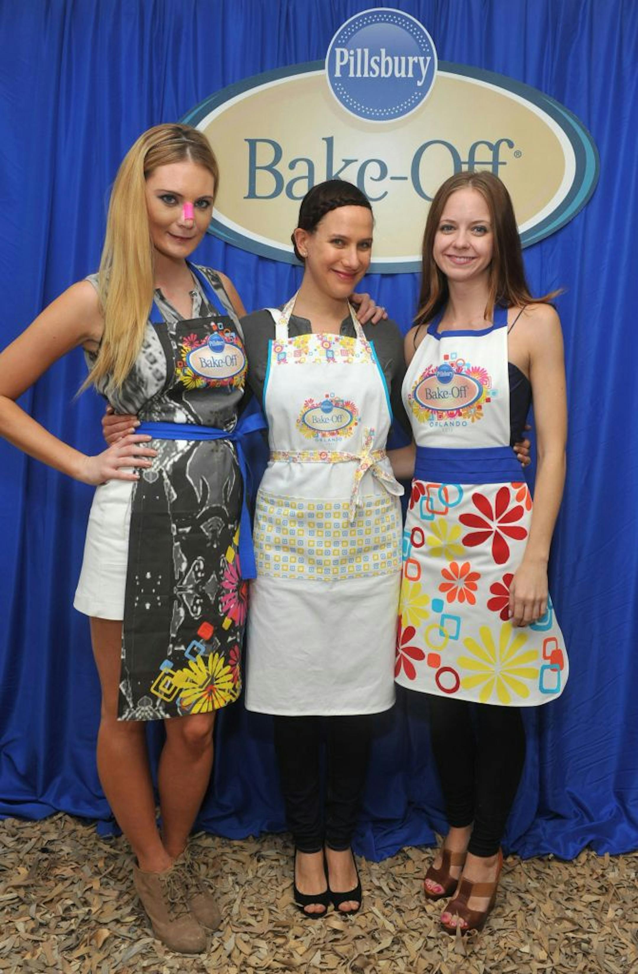 "Project Runway" designers (from left) Althea Harper, Kara Janx and Carol Hannah Whitfield model the aprons they designed.
