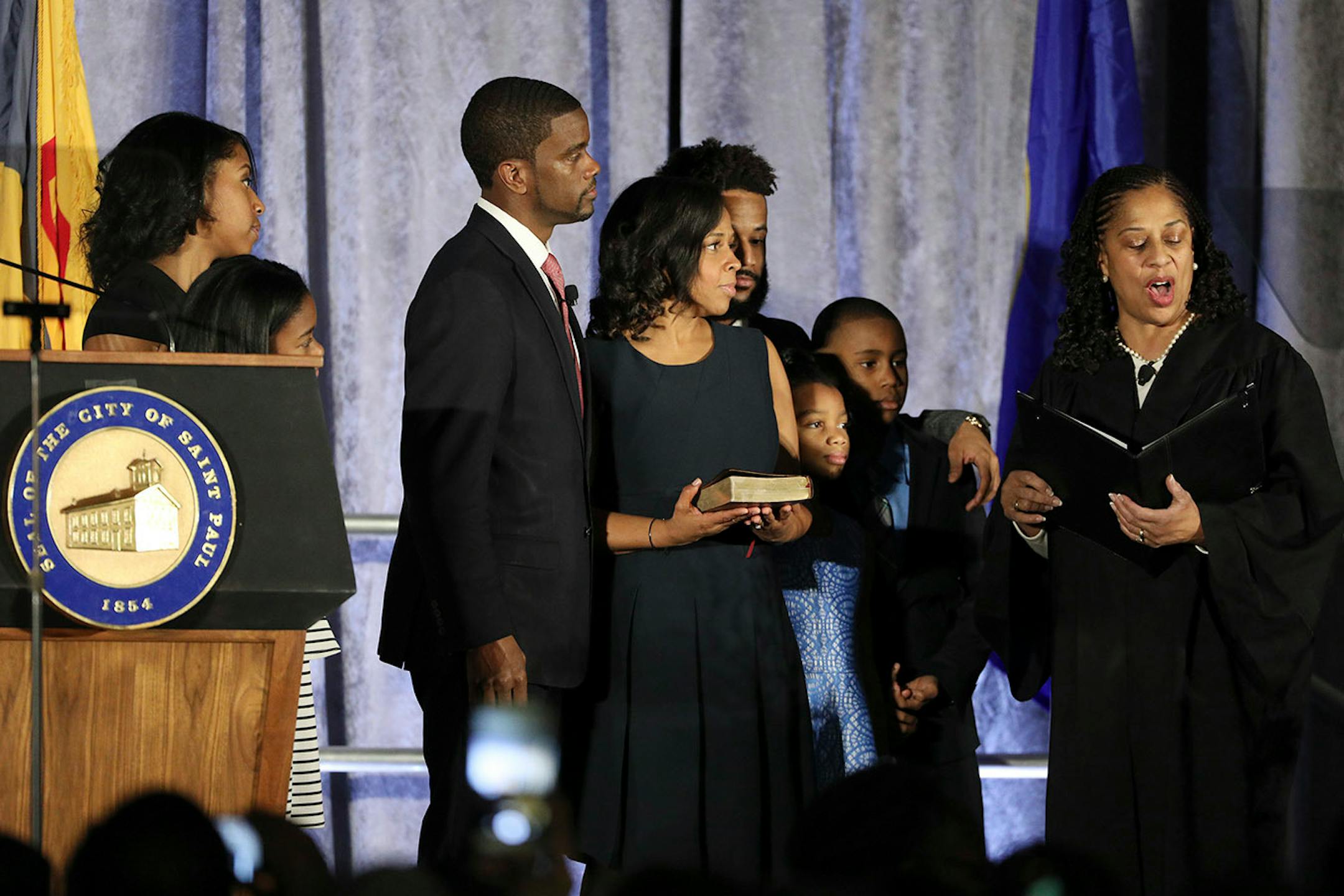 Melvin Carter and his wife Sakeena Carter were joined on stage by their family as Justice Tanya Bransford with the Fourth Judicial District administered the oath of office during Carter's swearing in ceremony as St. Paul mayor. ] ANTHONY SOUFFLE ï anthony.souffle@startribune.com Melvin Carter was sworn in as mayor Tuesday, Jan. 2, 2018 at his alma mater Central High School in St. Paul, Minn. The oath of office ceremony kicked off a week of events around the city, culminating in an inaugural ball